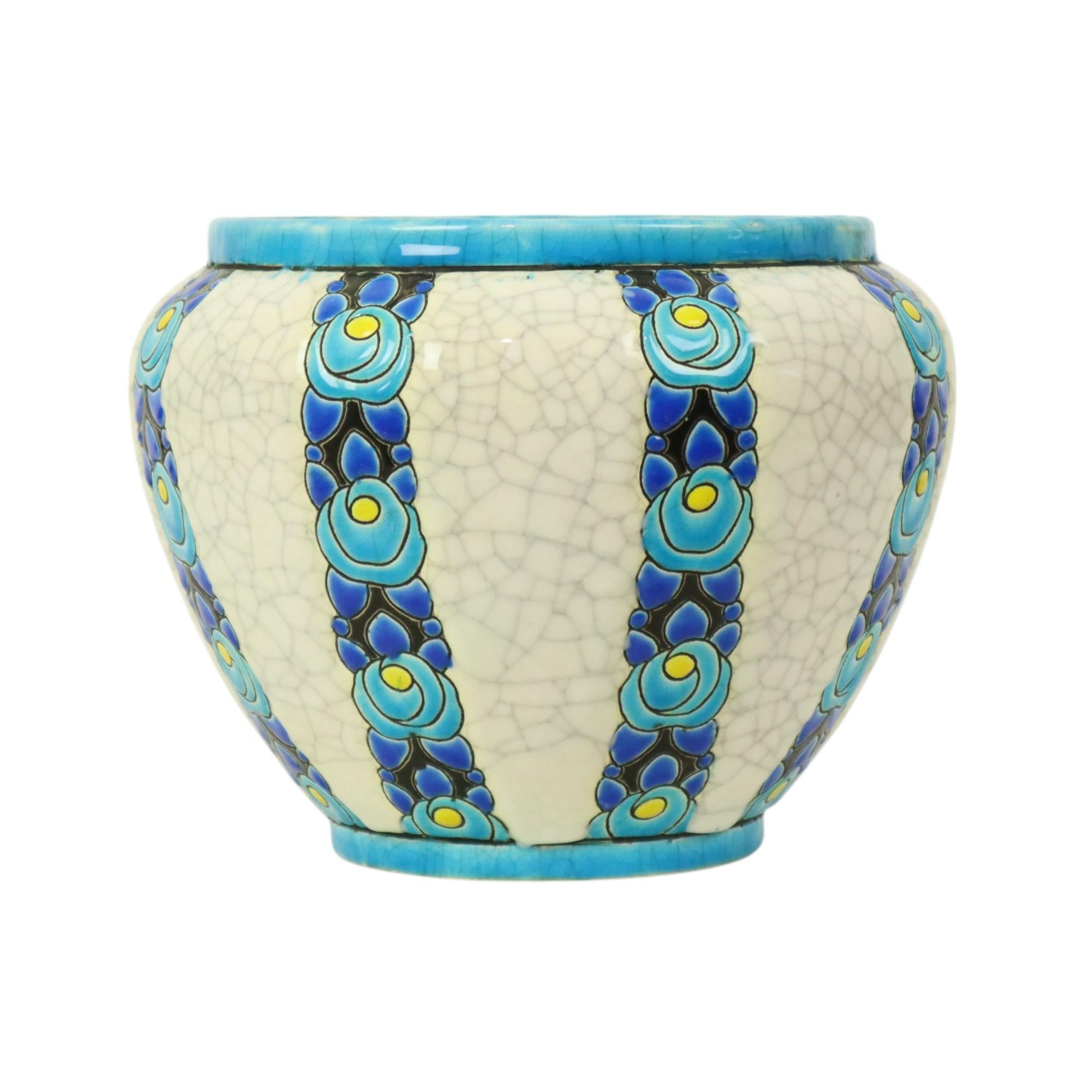 Beautiful and rare antique enamelled flower pot from the art deco period, designed by Charles Catteau for Boch Keramis, decor number D704, shape number F424, circa 1922-1924, Belgium, marked and numbered at the bottom.

This flower pot has a