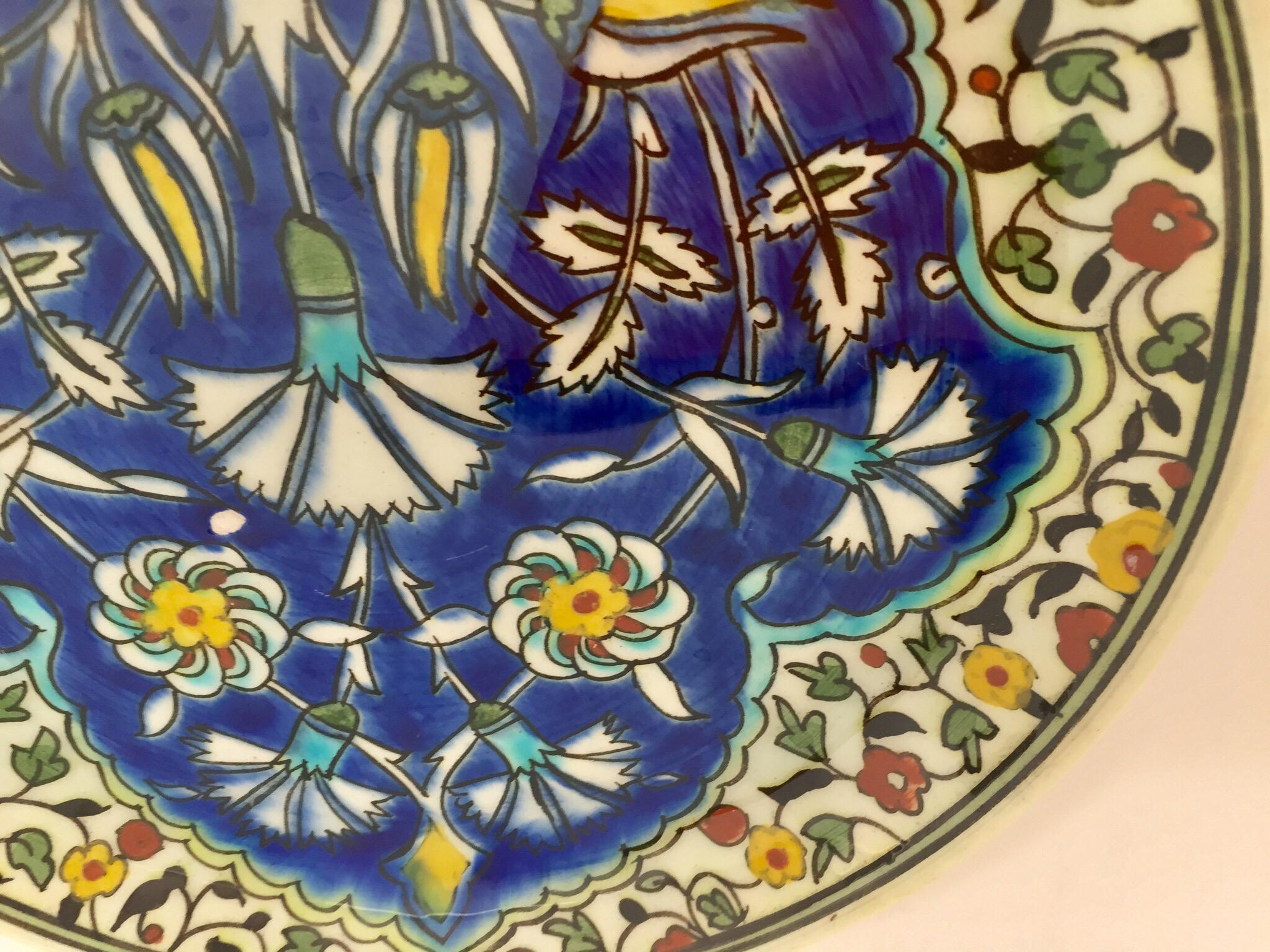 Polychrome hand painted and handcrafted ceramic wall decorative plate with polychrome floral design.
This is an intricately, hand painted plate that was made in Turkey.
Turkey is famous for its kiln products, such as tiles and pottery, which are