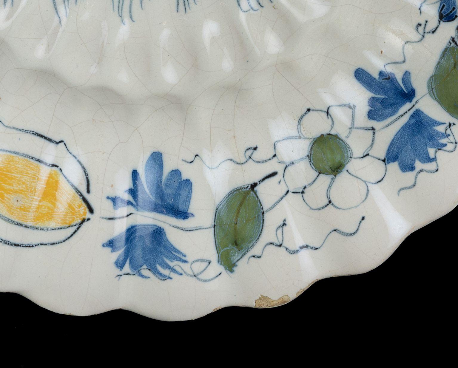 Glazed Polychrome Lobed Dish with Peacock and Tulips Delft, circa 1690 For Sale