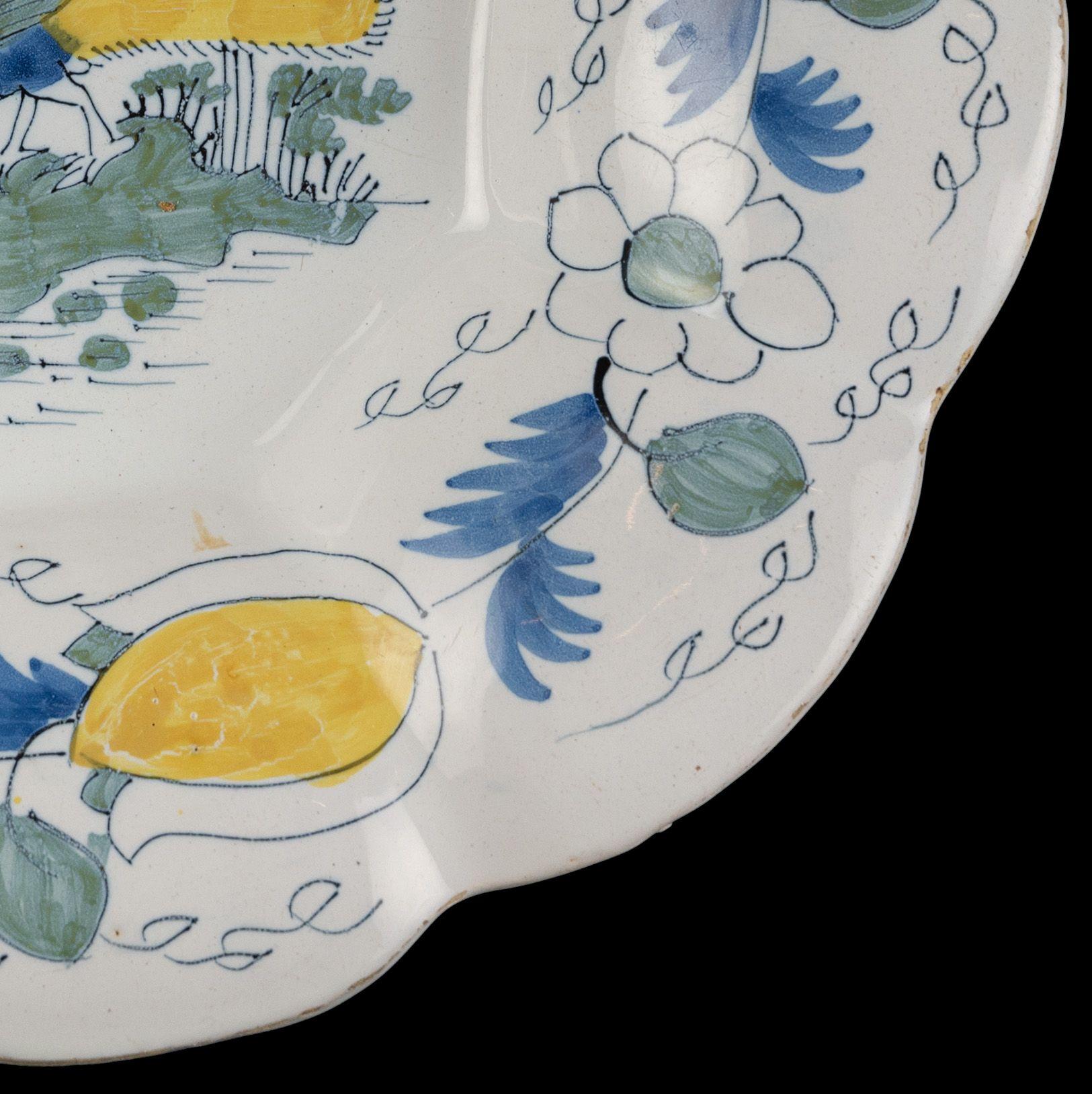 Polychrome Lobed Dish with Peacock in Landscape, Delft, circa 1690 In Good Condition For Sale In ROSSUM, GE