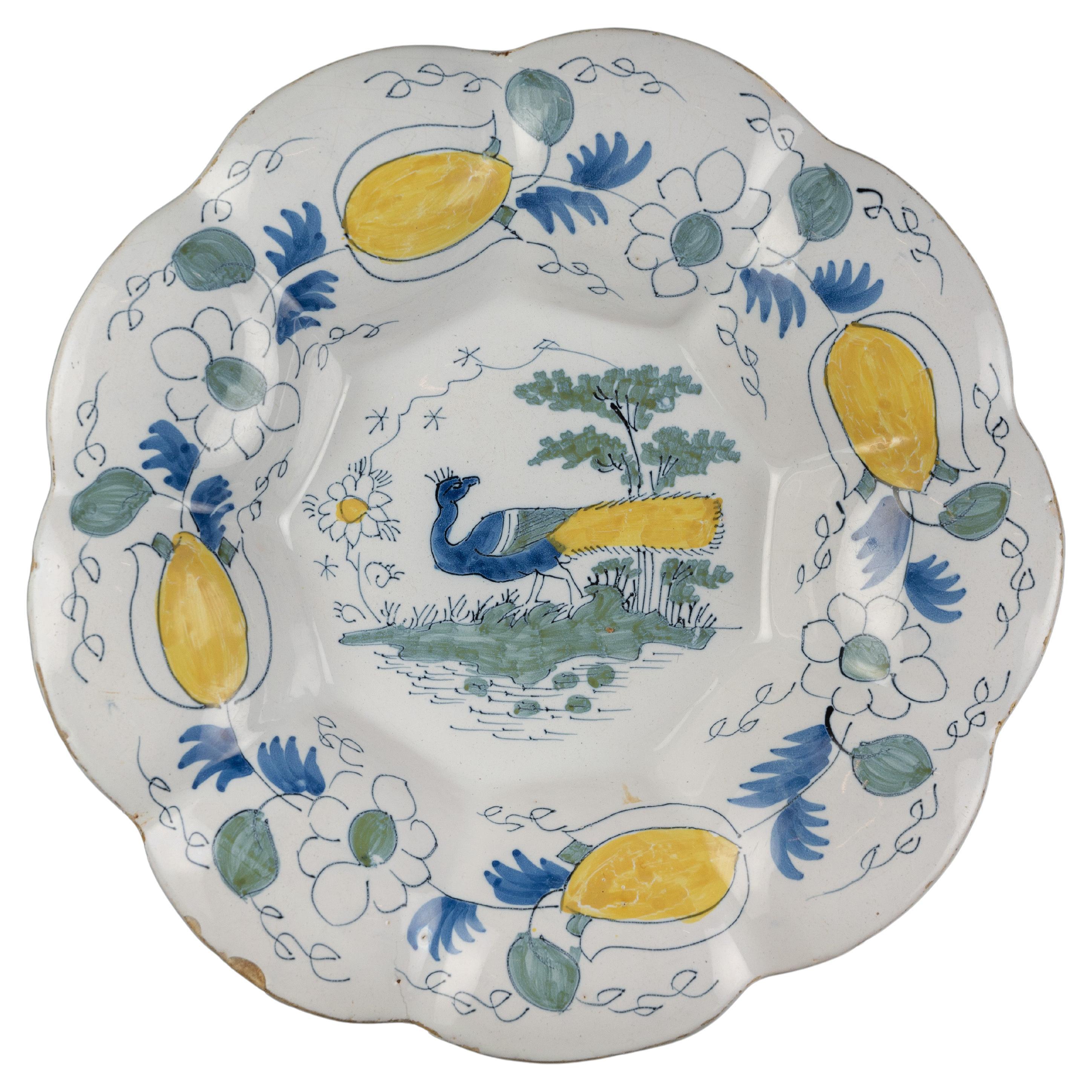 Polychrome Lobed Dish with Peacock in Landscape, Delft, circa 1690 For Sale
