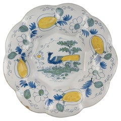 Antique Polychrome Lobed Dish with Peacock in Landscape, Delft, circa 1690