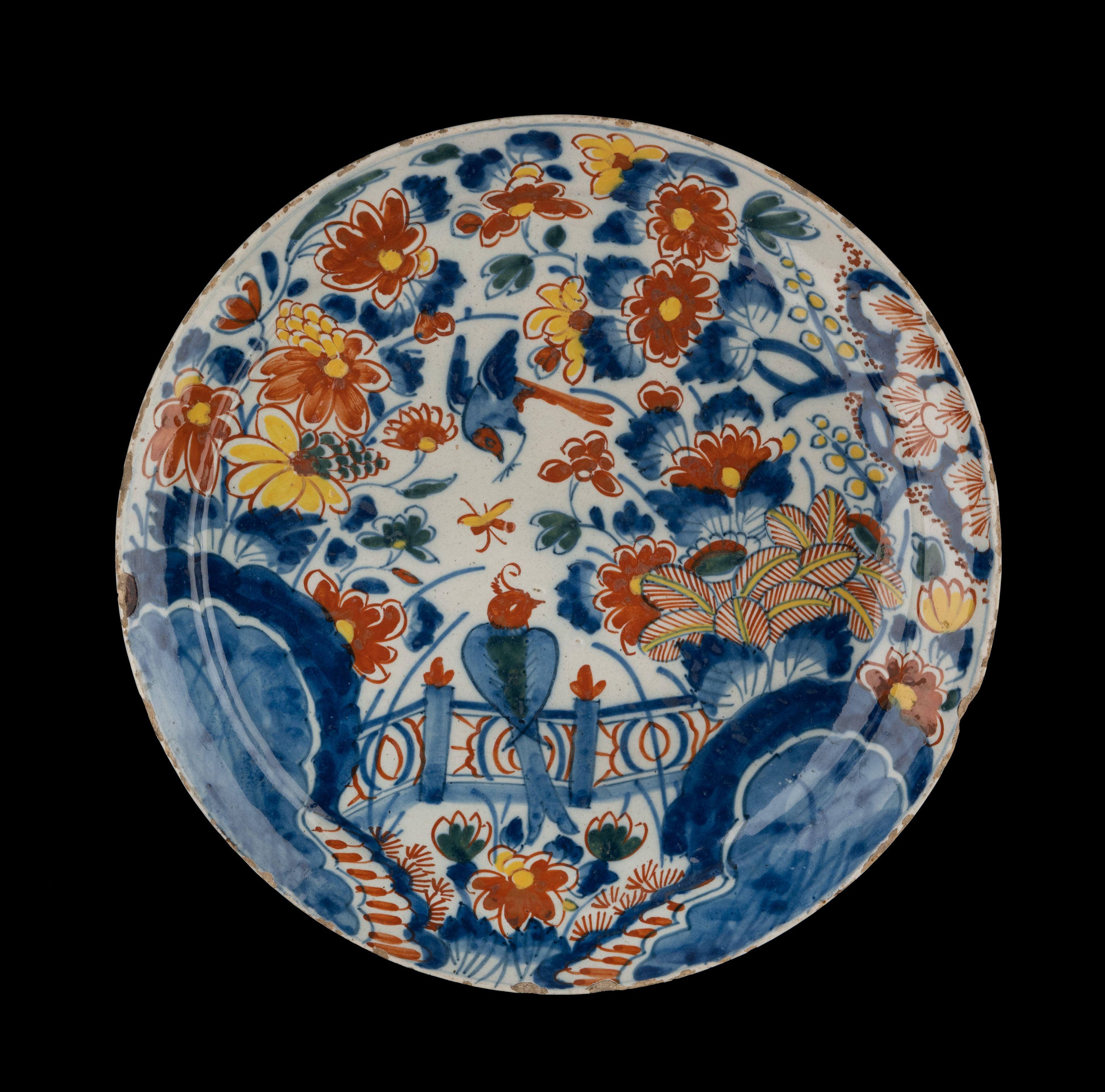 Polychrome plate with flowers. Delft, 1713-1740.

The porcelain claw pottery. 
Mark: IVL and 5, period of Johannes van Lockhorst and Margaretha van der Gucht (1713-1740).

The plate without foot rim has a narrow, flat flange and is painted in
