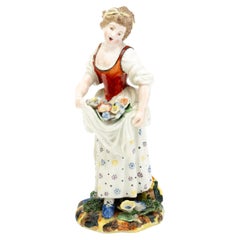 Polychrome Porcelain Figure of a Lady Collecting Flowers 19th Century