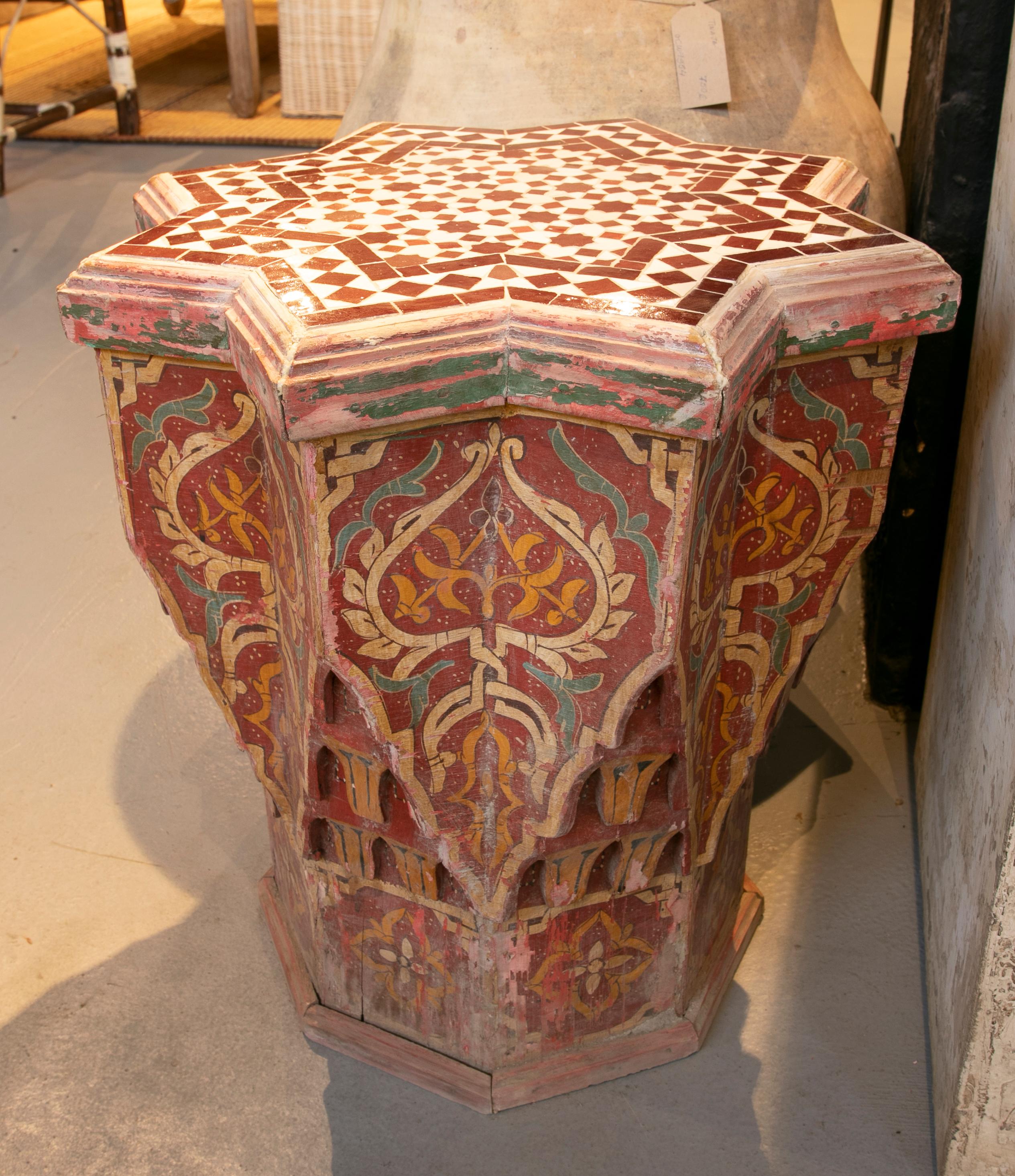 Polychrome wooden side table with tiled top.