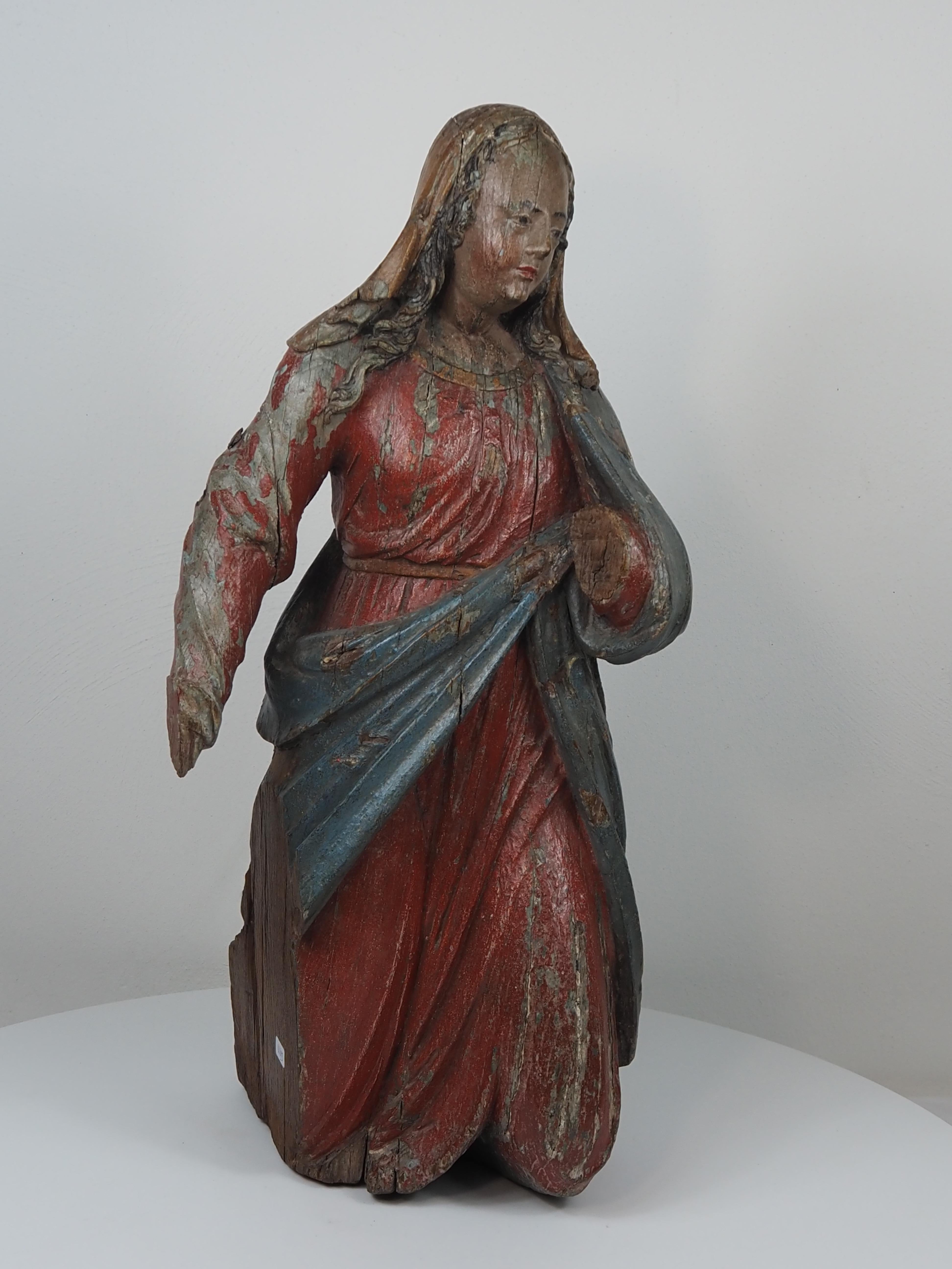 Polychromed Oak Figure of the Virgin, Kneeling
Germany or Flanders, first half of the 17th century
Carved and polychromed oak.
Height: ca. 50 cm.

A devotional sculpture of the Virgin Mary, shown kneeling with her head gently inclined and her arm