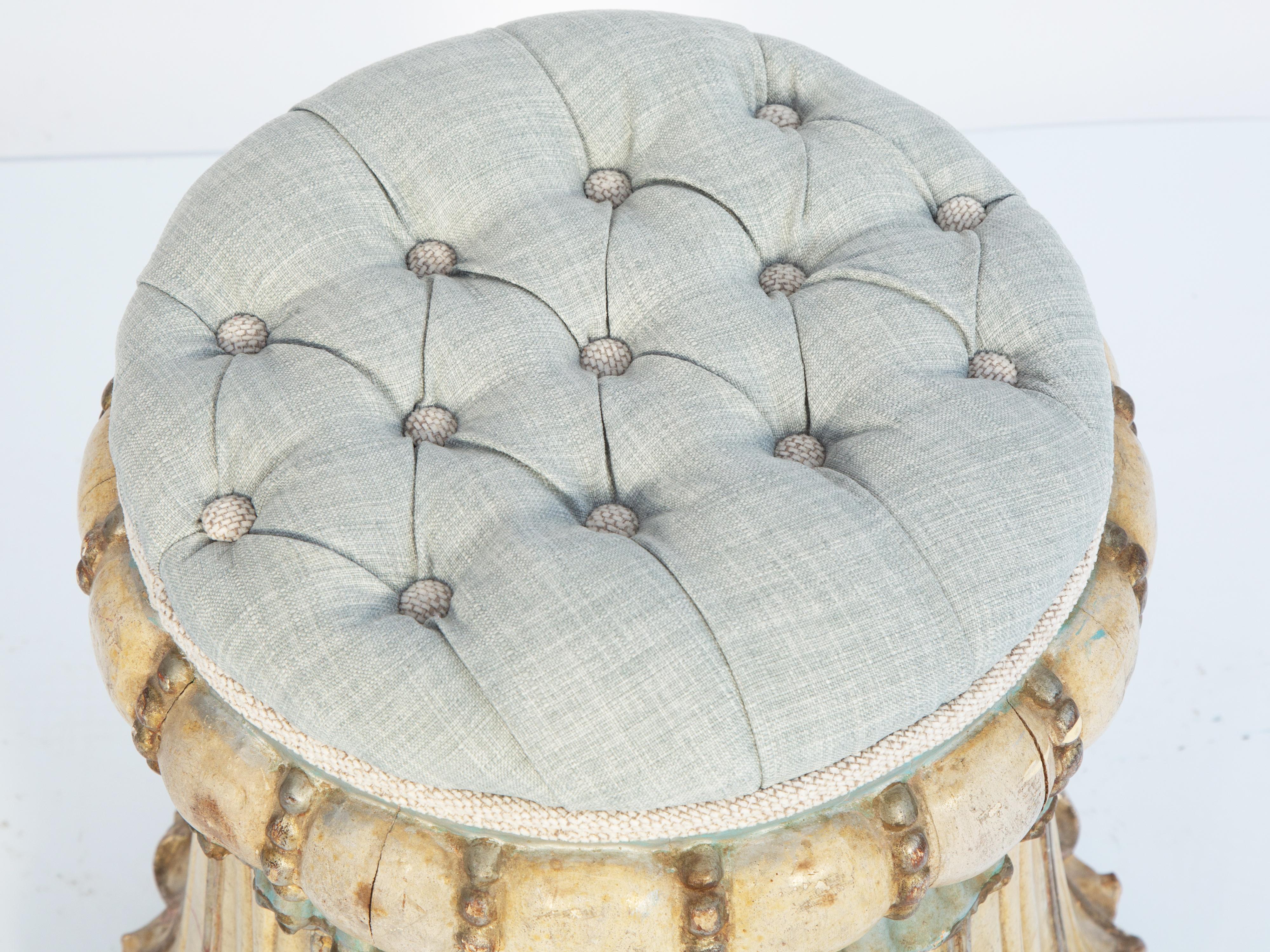 Venetian stool, having a round, tufted seat, its polychromed base carved as a tassel with bublous apron flanked by beading, over gathered 