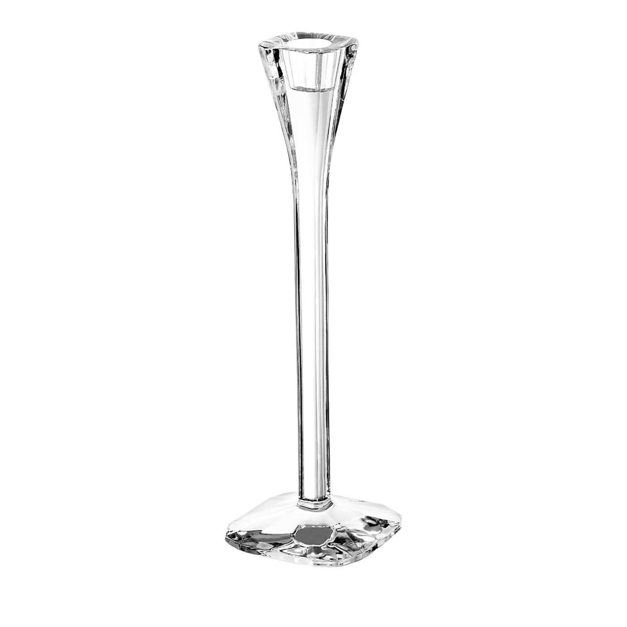 Transparent crystal gives the light reflecting off this candlestick a soft and elegant effect. Part of the Polygon collection by Catya Castel, this elongated design with a square base and flared top was created in 1979 and is a timeless and