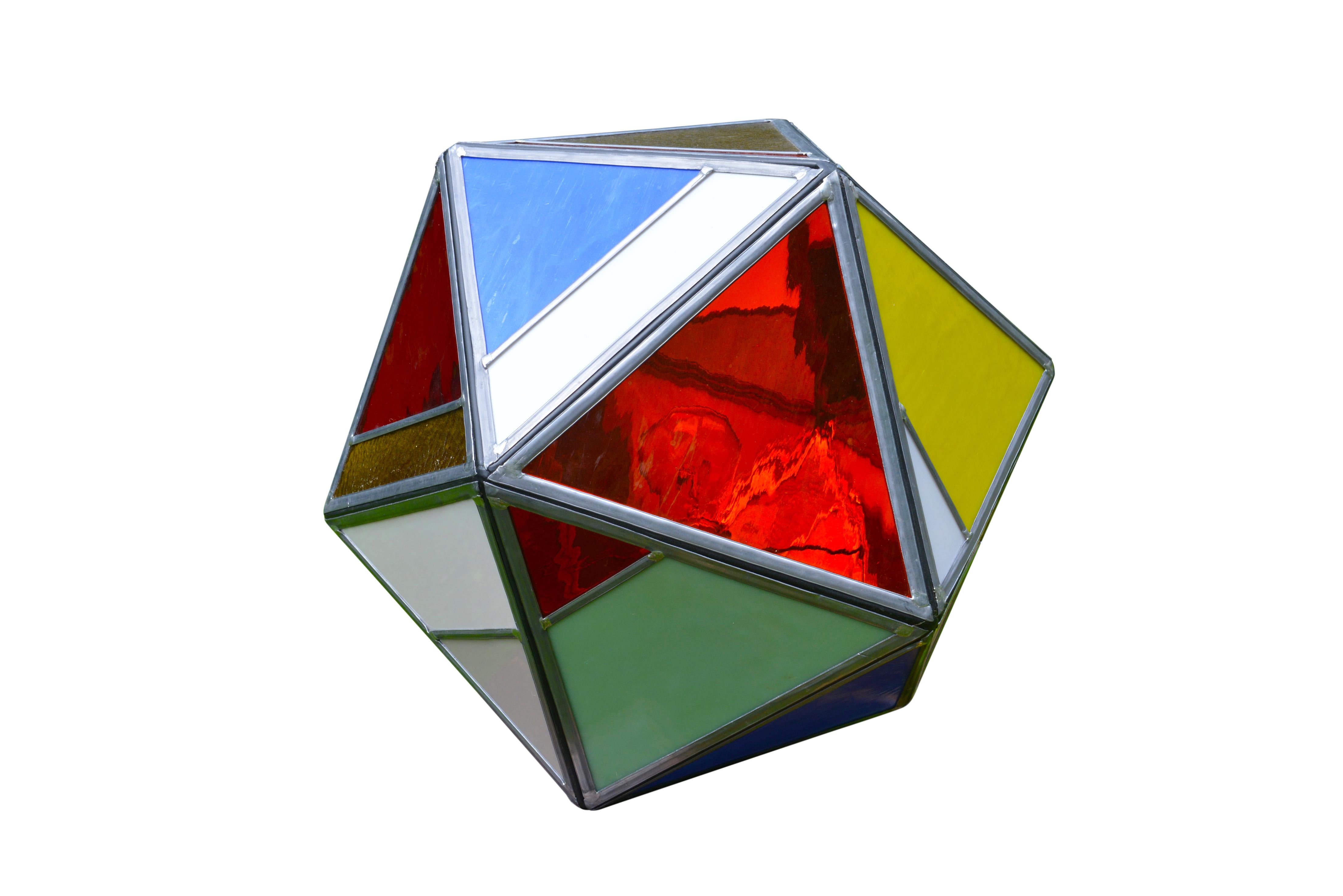 These funky disco-is table lamps were made in Bruges by two local artists, a metal and a glass artisan. This one is of polyhedral shape and has different colors and types of lead glass inserts.