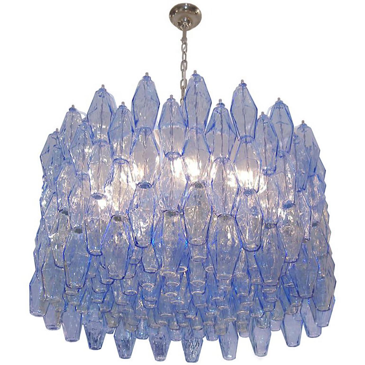 A blue polyhedral glass chandelier with chrome canopy and chain.