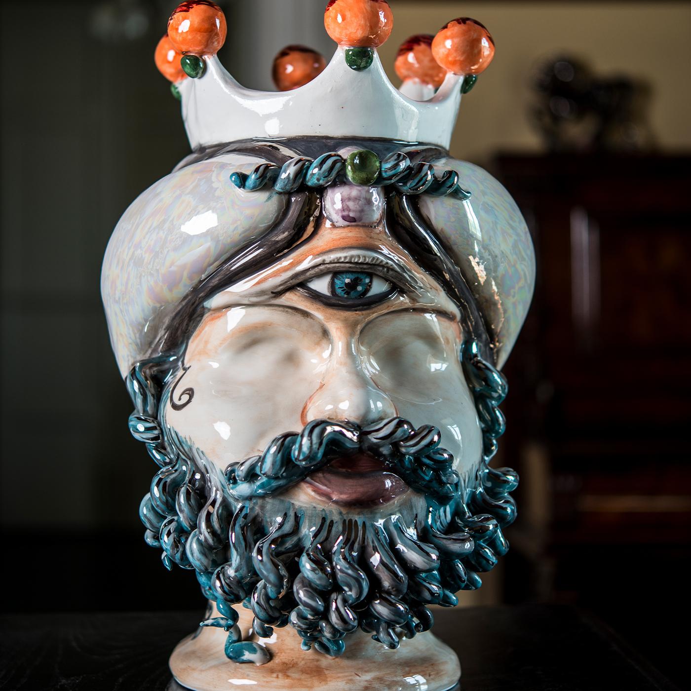 This elegant and exotic Polyphemus evokes all the myth’s brutal and instinctive strength, pulling the viewer in an emotionally disarming imagination. This gorgeous majolica sculpture is a modern interpretation of the Sicilian Moor's head which has