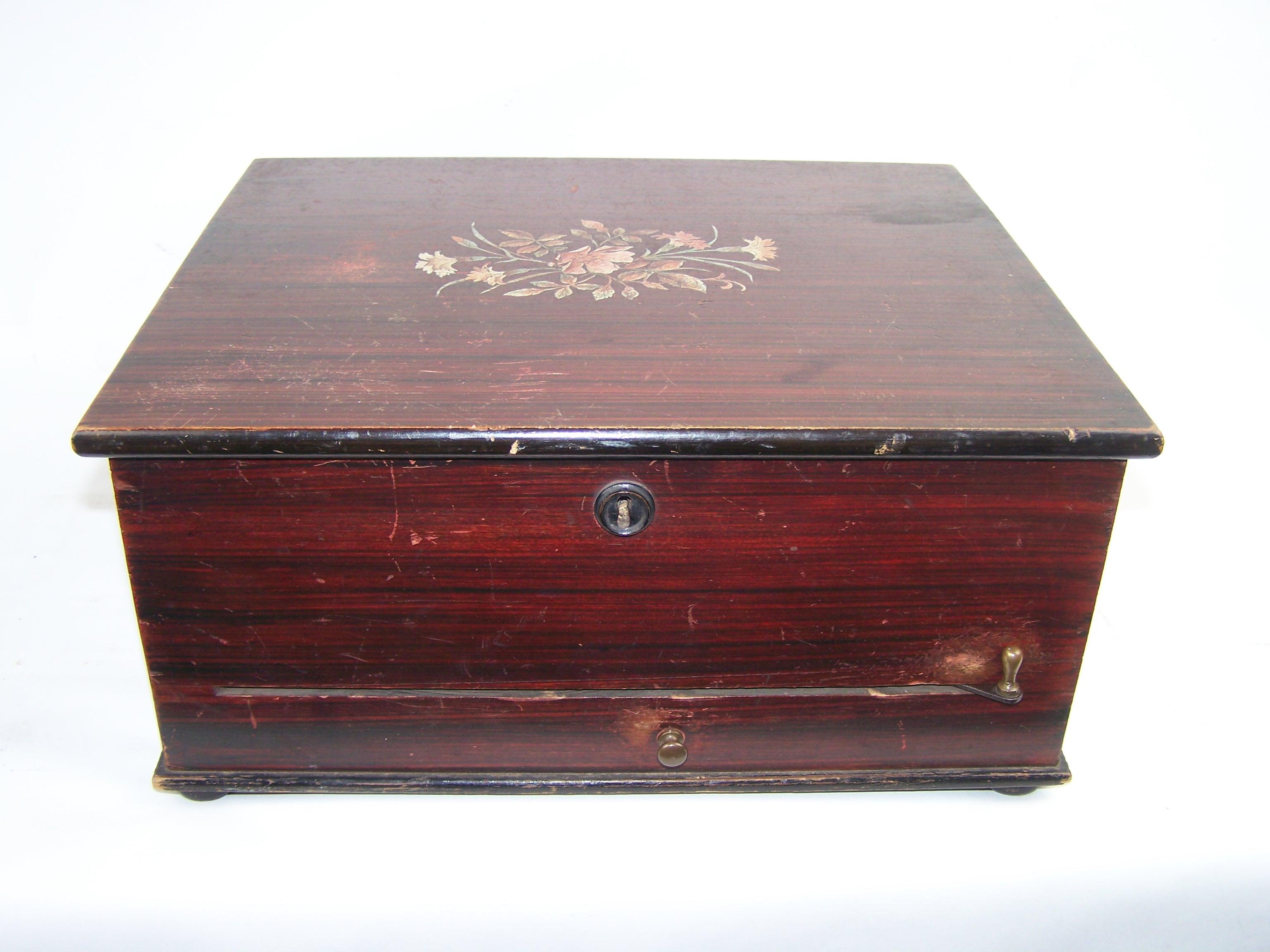 Beautiful and Rare Polyphon Music Box with Bells – Type 71G

This lovely Polyphon music box, model 71G, plays music using 24.5 cm discs, which are green and specially made for this model.

It features a ratchet wind mechanism and is started via a