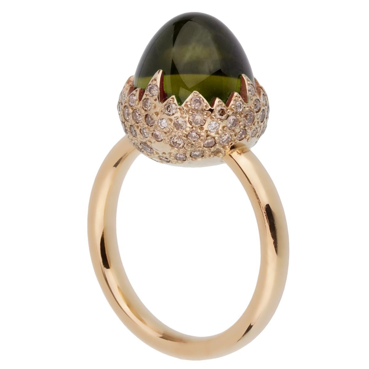 An iconic Pomellato diamond ring showcasing a 6.19ct Peridot encased by .59ct of round brilliant cut diamonds in shimmering 18k gold. The ring measures a size 6 and can be resized

Pomellato Retail: $9450
