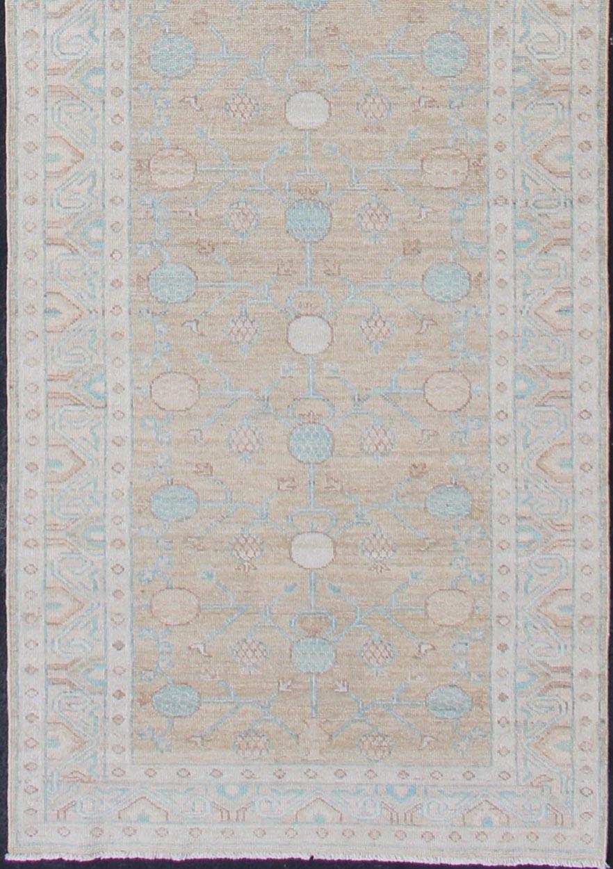 Long Khotan runner in Pomegranate Khotan Design, rug MP-1910-10524, country of origin / type: Afghanistan / Khotan

This Khotan features a geometric all-over Pomegranate design in the background flanked by a repeating pattern in the border. The