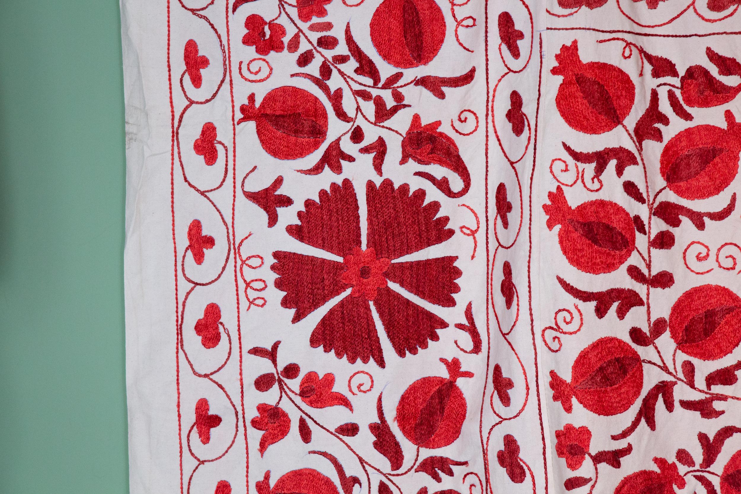 Pomegranate Suzani II. Handmade cotton Suzani with pomegranate designs. Measures: 55