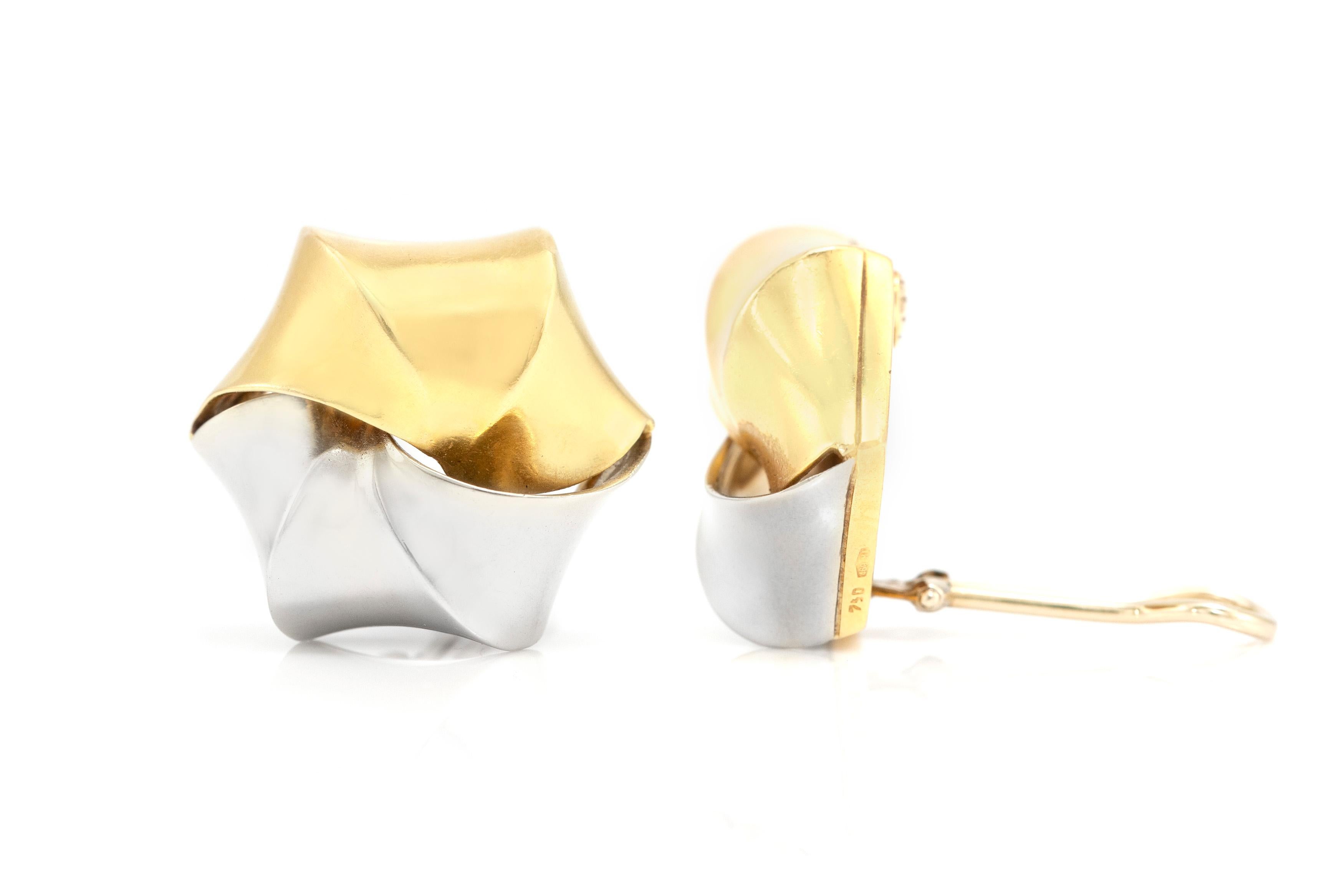 Pomellato two toned clip on earrings are finely crafted in 18K gold.