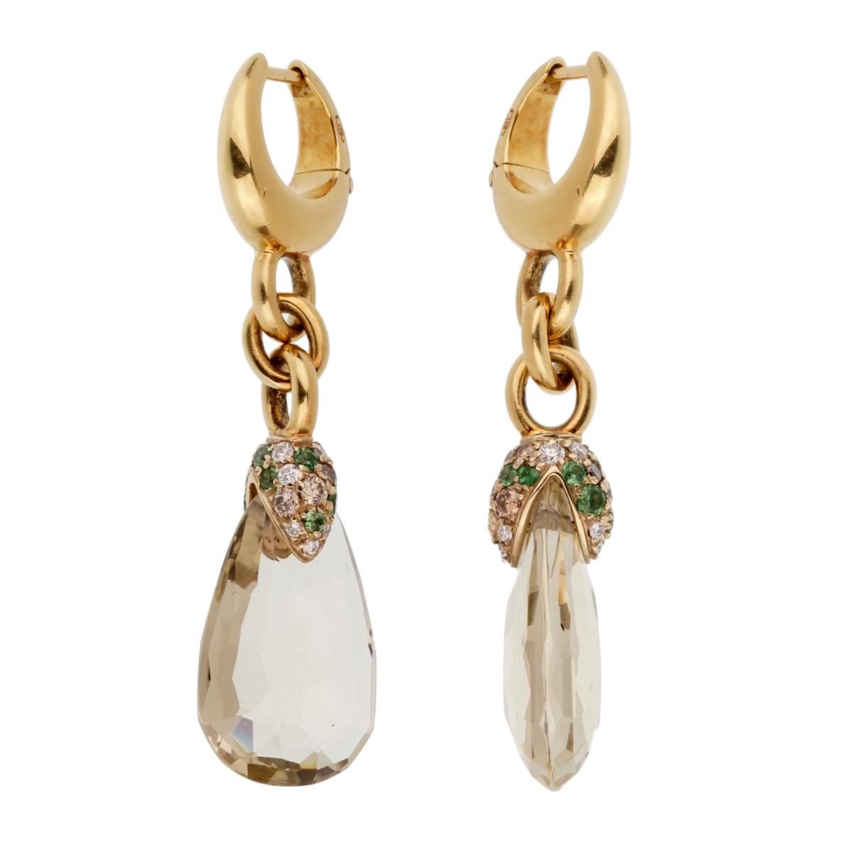 A magnificent pair of brand new Pomellato earrings showcasing 12.42ct of Green Quartz adorned by .59ct of round brilliant cut diamonds in 18k yellow gold.

Pomellato Retail Price: $8600
Sku: 2195