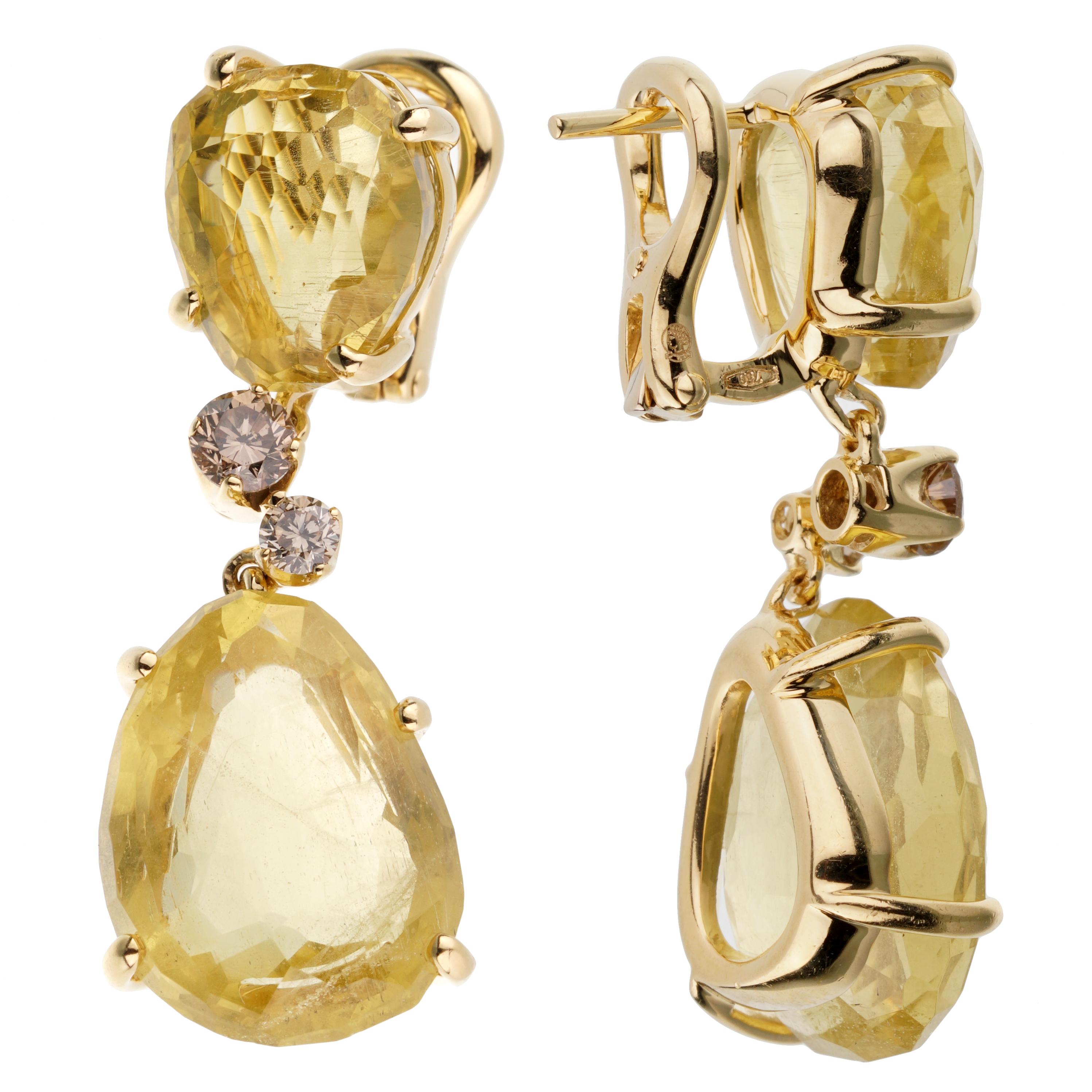 A fabulous pair of authentic Pomellato drop earrings showcasing 12cts of Lemon Quartz separated by .46ct of round brilliant cut champagne diamonds.

Retail Price: $21,000+ Tax