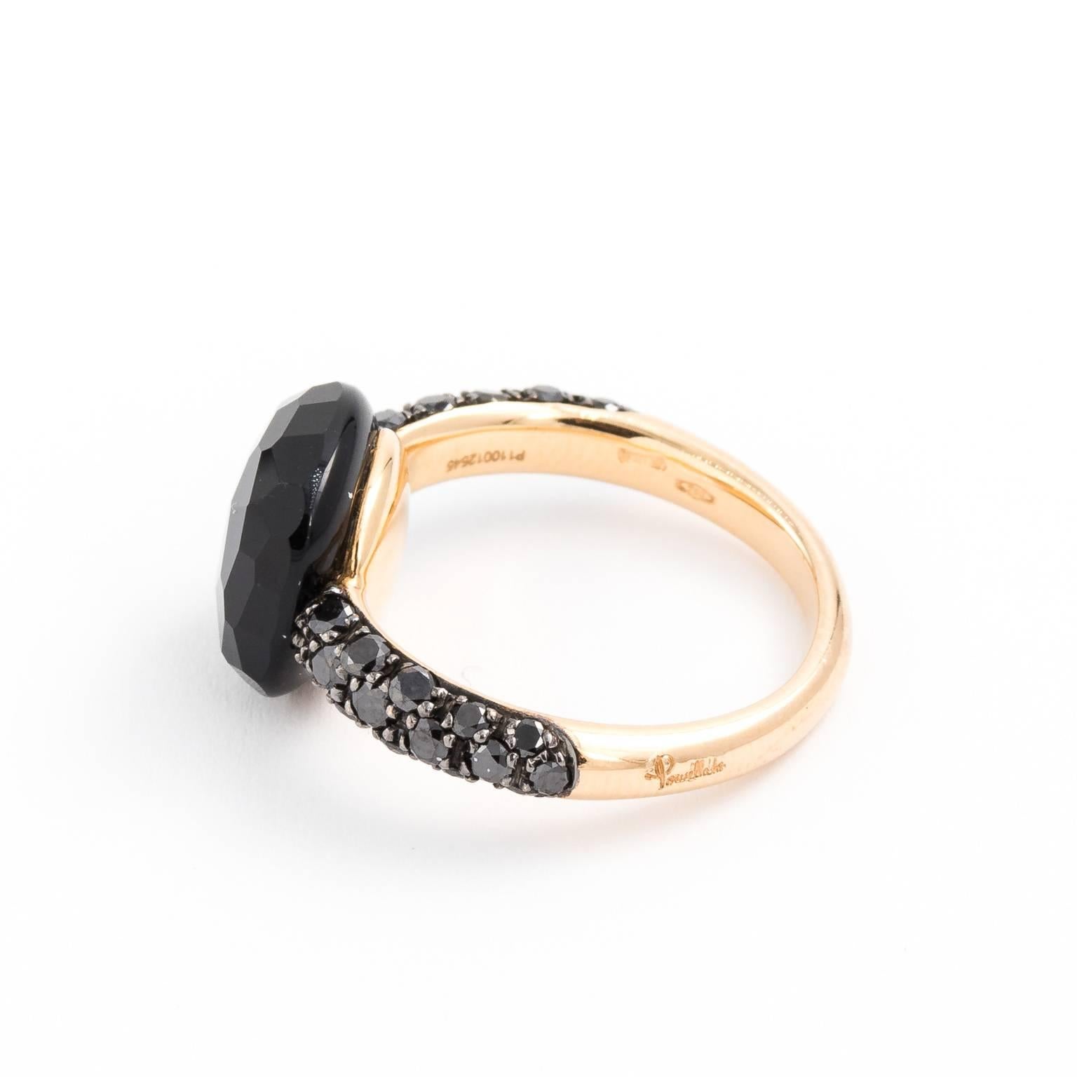 Contemporary Pomellato 18 karat ring with black diamonds and onyx. Shank in yellow 18 karat gold and black diamonds that are set half way up shank that is visible at the top of the ring. Approximately 6 carats of faceted black onyx in square shape