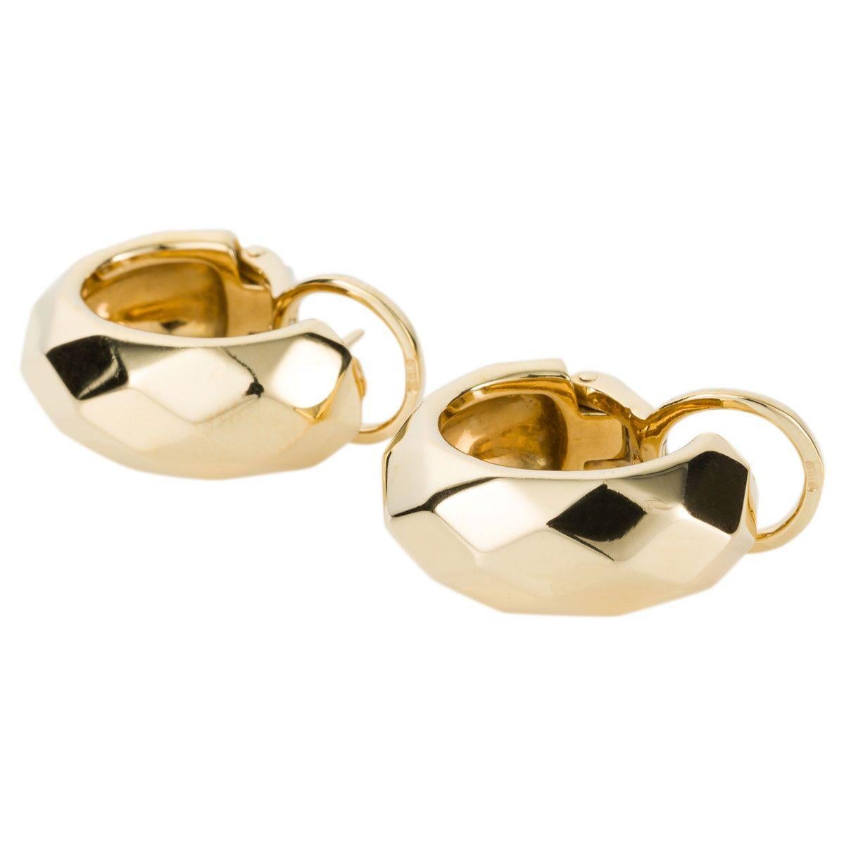 How fashionable are these earrings and so wearable for all occasions, beautifully crafted which is typical of the Italian designer Pomellato. High polish wide gold hoops that have a gentle diamond shaped faceting which throws off light in different