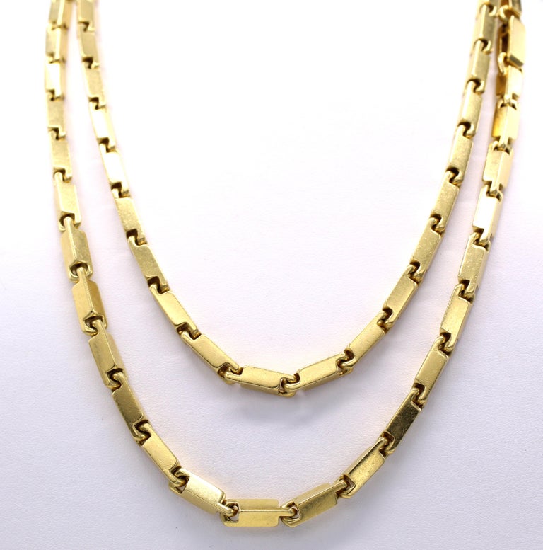 Finely handcrafted 18 karat gold link chain which can be worn as a long chain, doubled up to various lengths or as a chain and a bracelet. The length of the entire necklace 42 inches, when split up you have a bracelet almost 8 inches in length and a