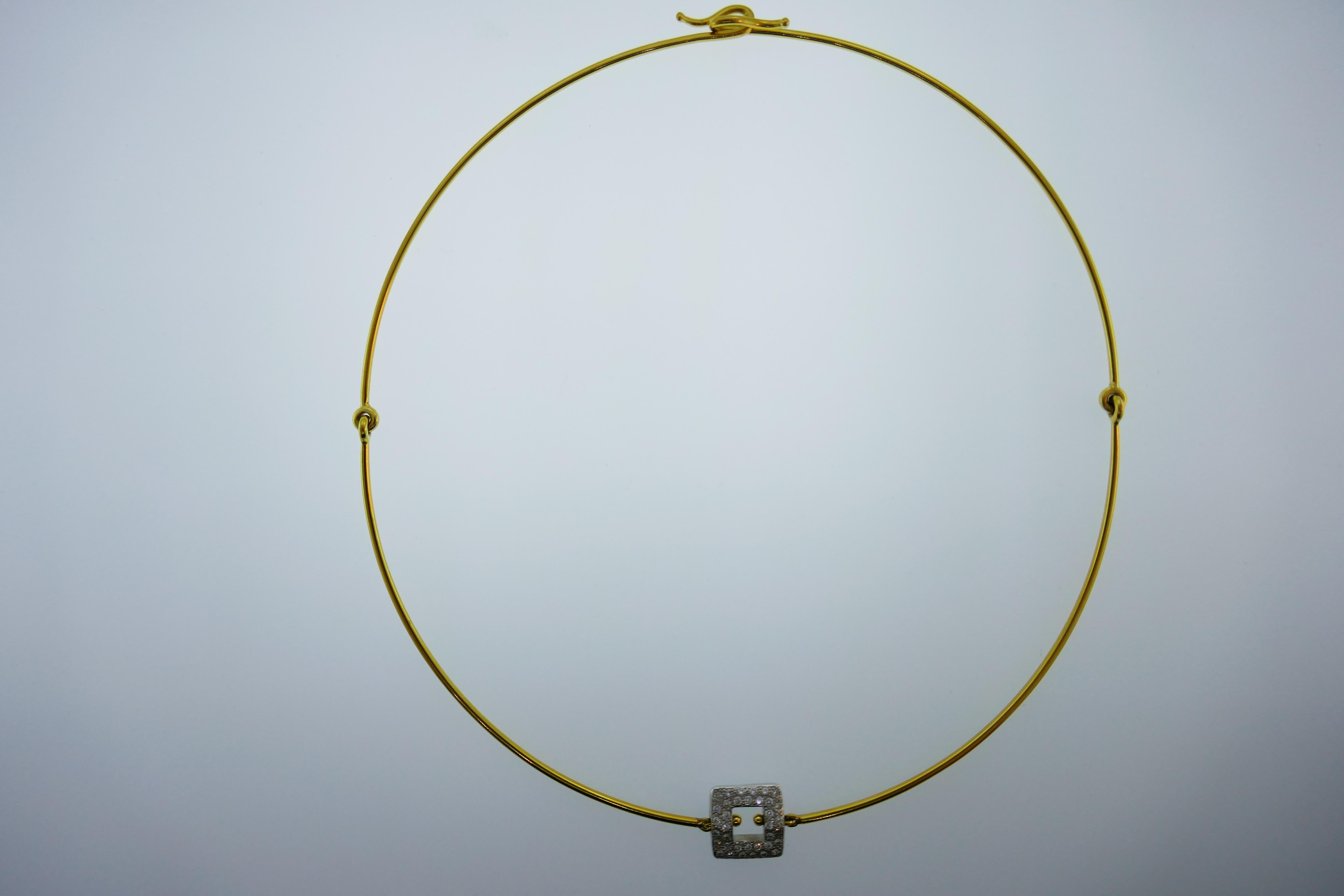 Very unique Pomellato necklace in 18 karat yellow gold with an attached diamond square shaped pendant. Very unique as it is comprised of four large links and fits like a choker. 

Weight: 17.8 grams 

Dimensions: 15.7