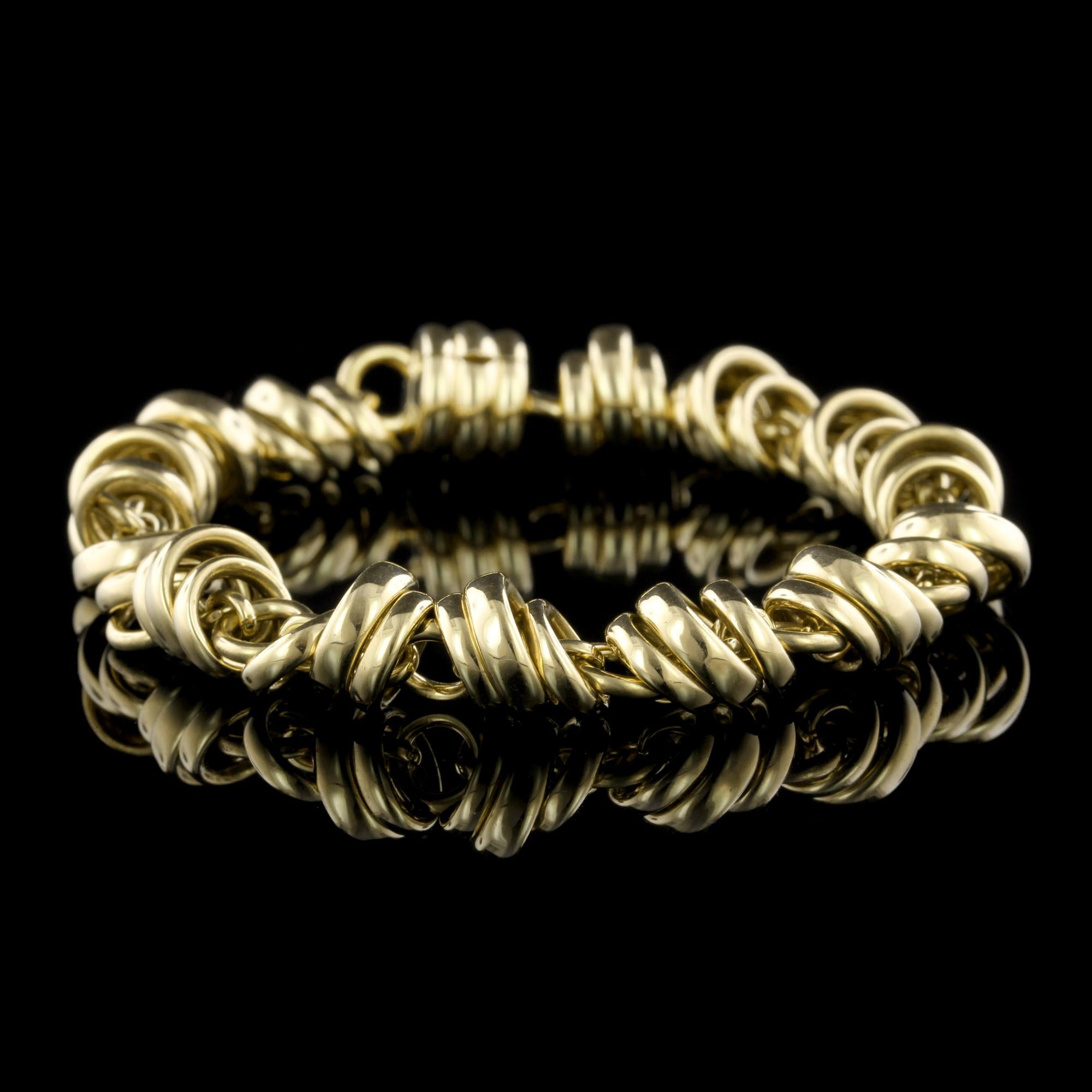 Pomellato 18K Yellow Gold Bracelet, Italy. The bracelet is designed with moving circular links, length 7 3/8
