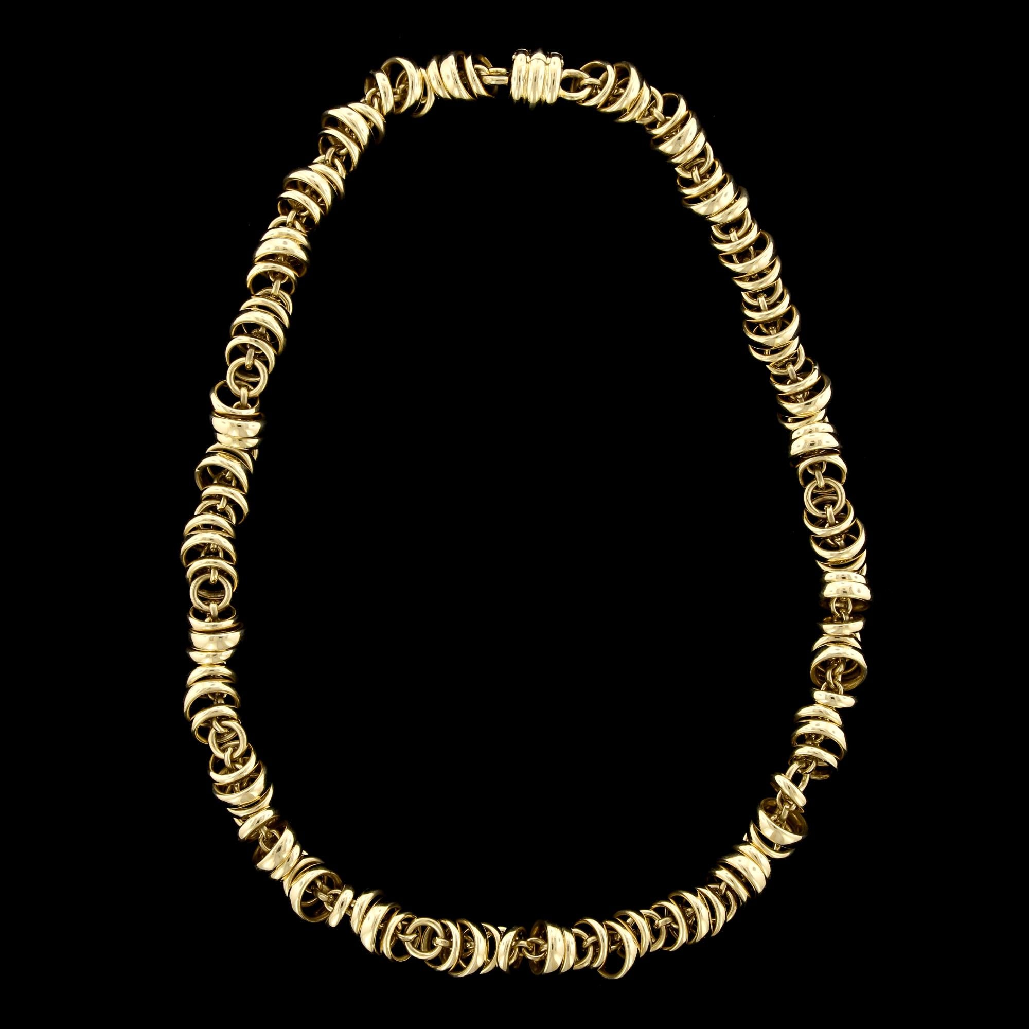 Pomellato 18K Yellow Gold Necklace, Italy. The necklace is designed with moving circular links, length 17