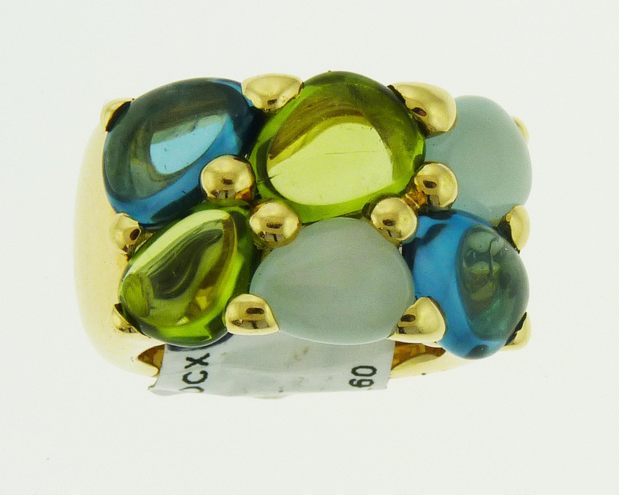 Beautiful ring created by Pomellato featuring 4.40 carats of free shape peridot, 4.20 carats of free shape blue topaz, 4.00 carats of free shape aquamarine. 
Signed Pomellato. 
Weight of the ring is 26.00.
Size 6.