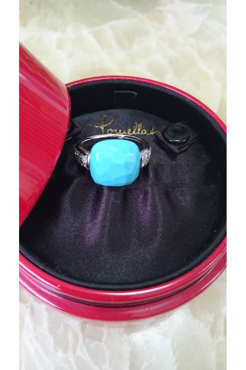 Beautiful Pomellato ring!

Origin: Italy
Period: 2000-2018
Materials: 18k gold, diamond, turquoise.
Condition: Excellent. 
Creation Date Circa 2008.
Description:
18kt white gold ring, featuring 0.26ct of diamonds and faceted cushion cut turquoise.