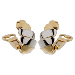 Orecchini a clip in oro bianco giallo a onde di Pomellato 18 ct.