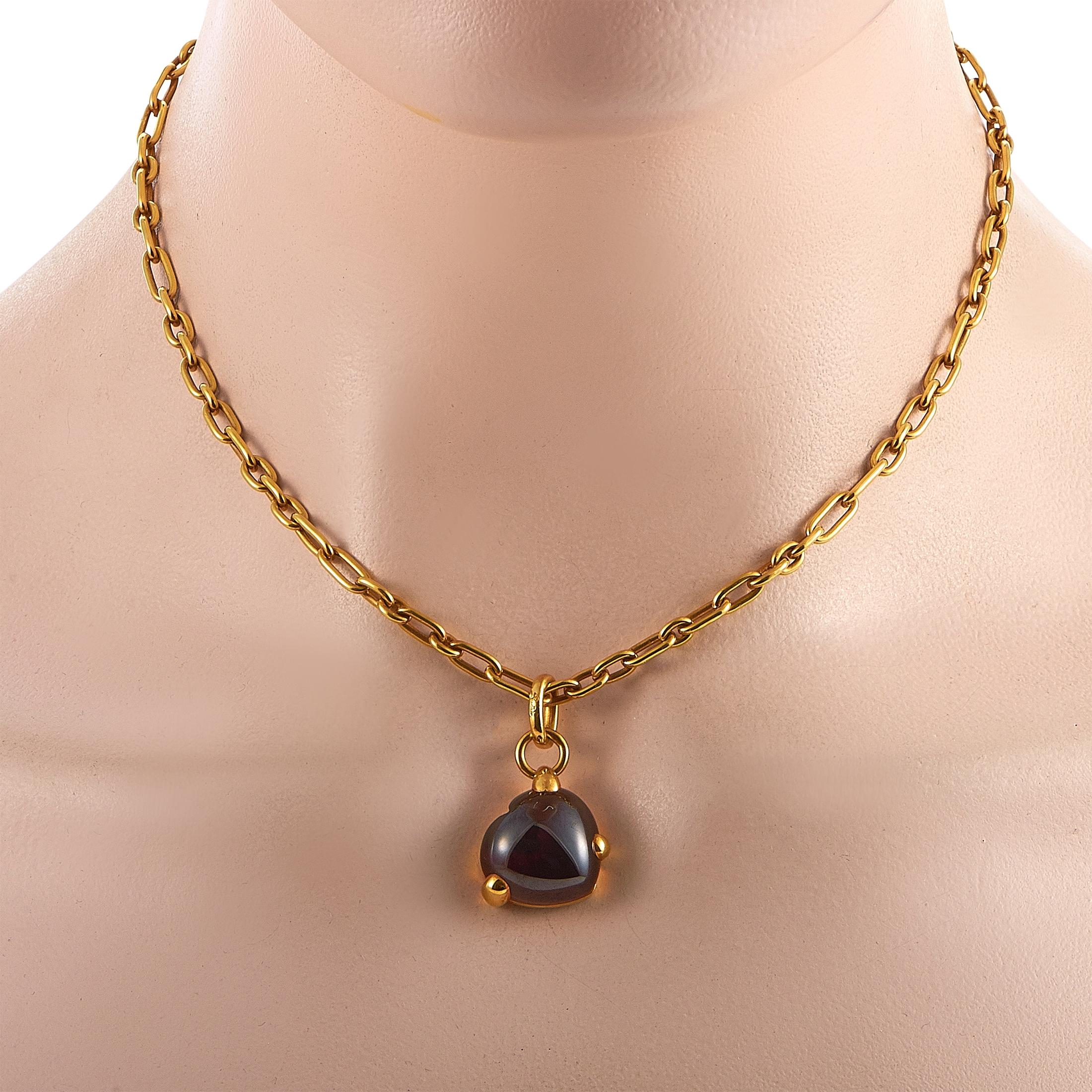 This Pomellato necklace is crafted from 18K yellow gold and embellished with a garnet. The necklace weighs 33.8 grams and is presented with a 16” chain and a pendant that measures 1.25” in length and 0.75” in width.

Offered in estate condition,