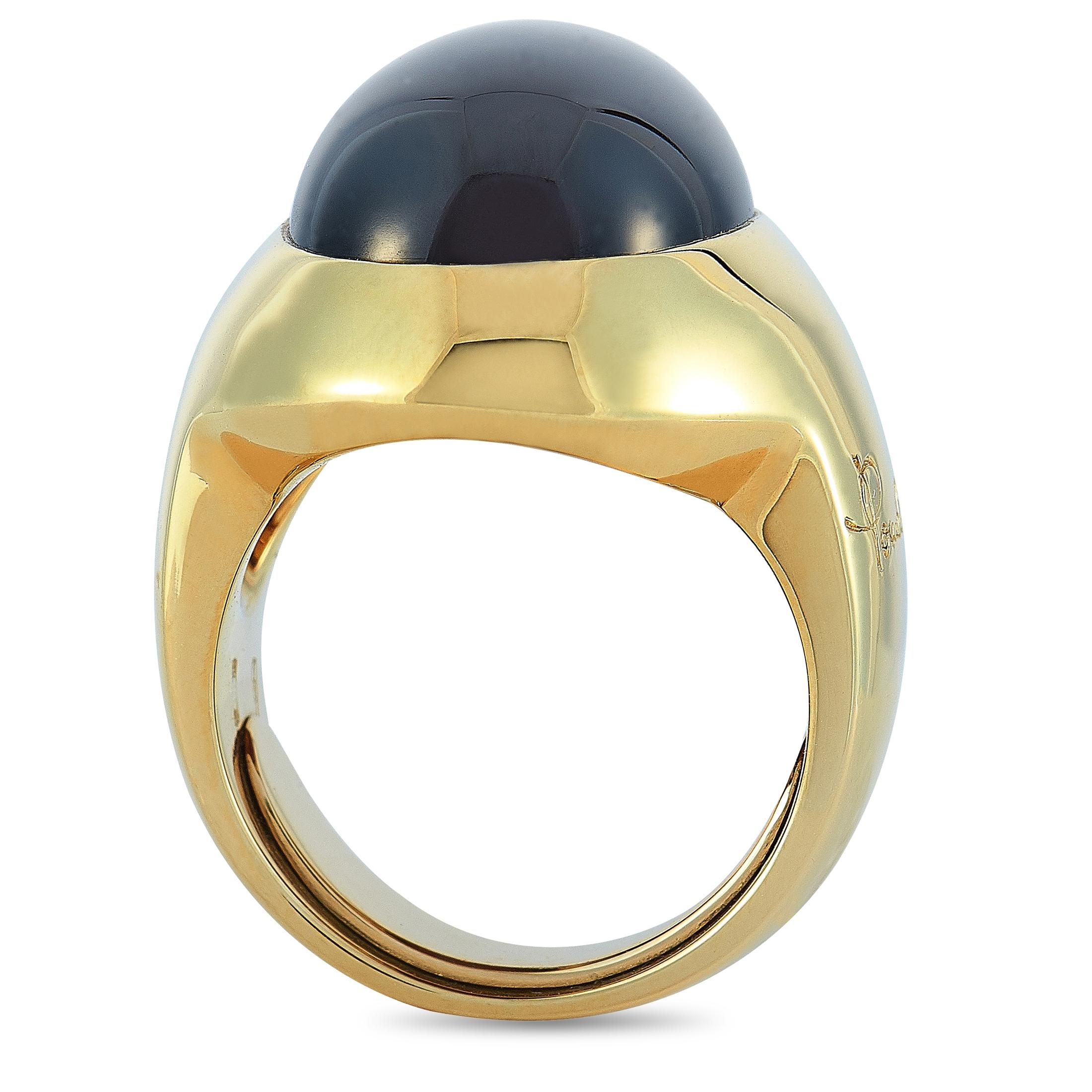 This Pomellato ring is crafted from 18K yellow gold and set with a garnet. The ring weighs 20.2 grams and boasts band thickness of 6 mm and top height of 10 mm, while top dimensions measure 14 by 18 mm.
 
 Offered in estate condition, this jewelry