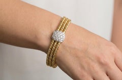 Pomellato Pulsera de tres vueltas de diamantes en oro amarillo y blanco de 18 quilates 7,50