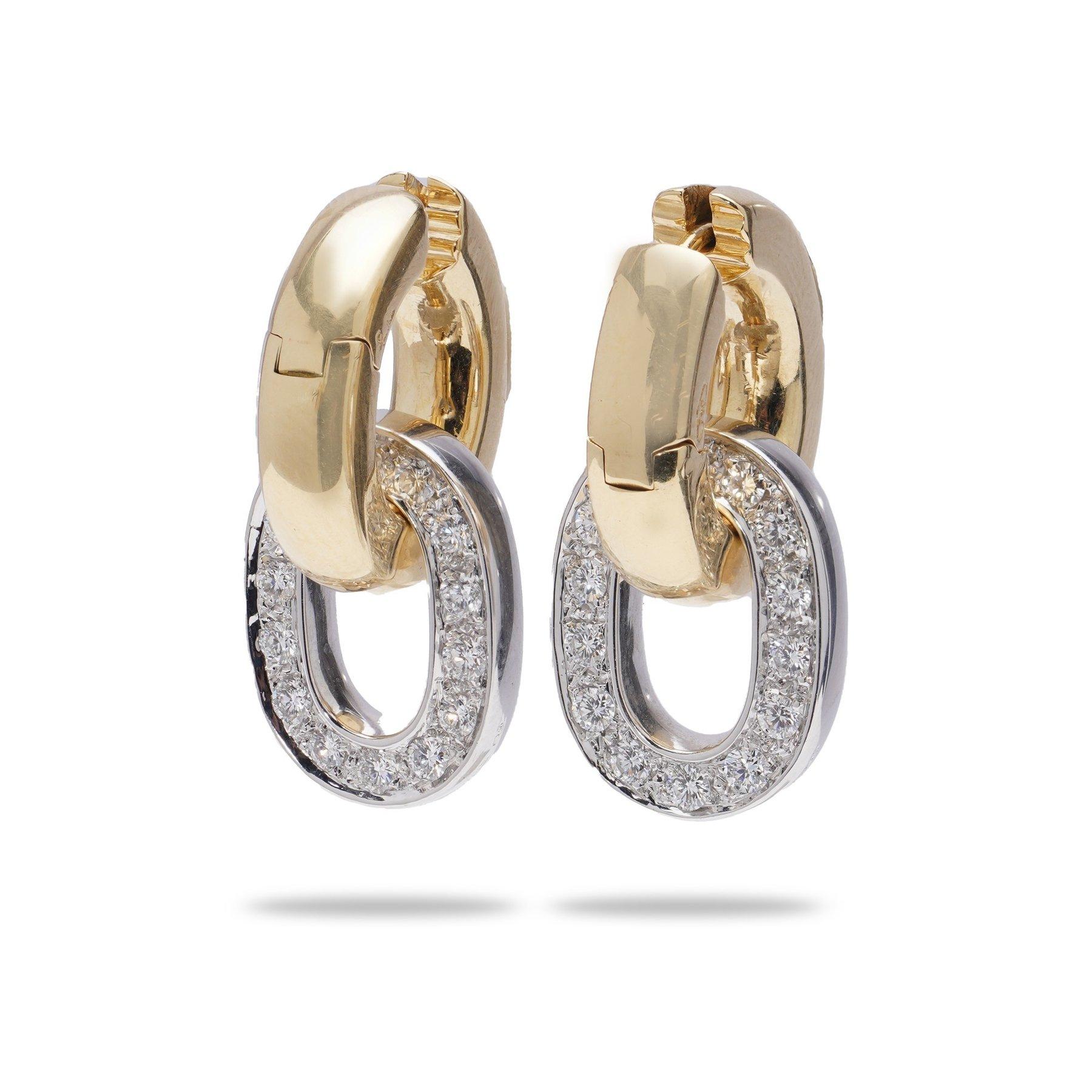 Pomellato 18kt yellow and white gold hoop earrings with 1.50 cts. diamonds. 

Dimensions - 
1st hoop size: 1.7 x 0.3 cm 
2nd hoop size: 1.6 x 0.2 cm 
Approx. Strap length: 71 cm 
Weight: 18.44 grams

Diamonds -
Cut: Round brilliant
Quantity of