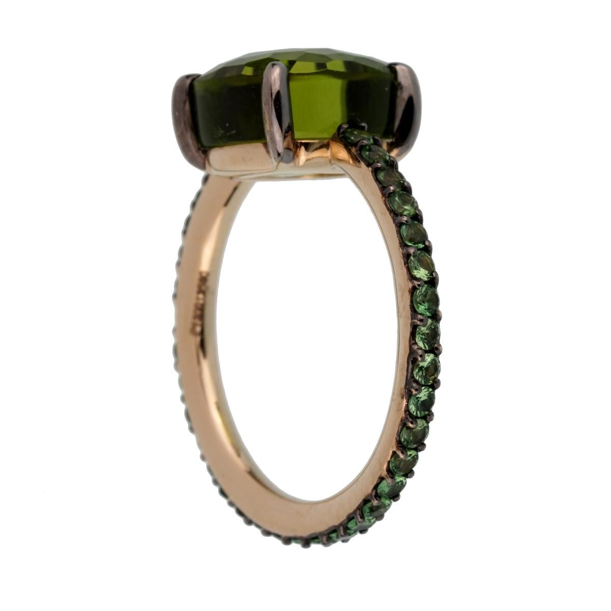 A fabulous brand new Pomellato cocktail ring showcasing a 3.56ct Peridot surrounded by .61ct of brilliant round tsavorite garnets set in 18k white gold.

Pomellato Retail Price: $10,500
Sku:2444
