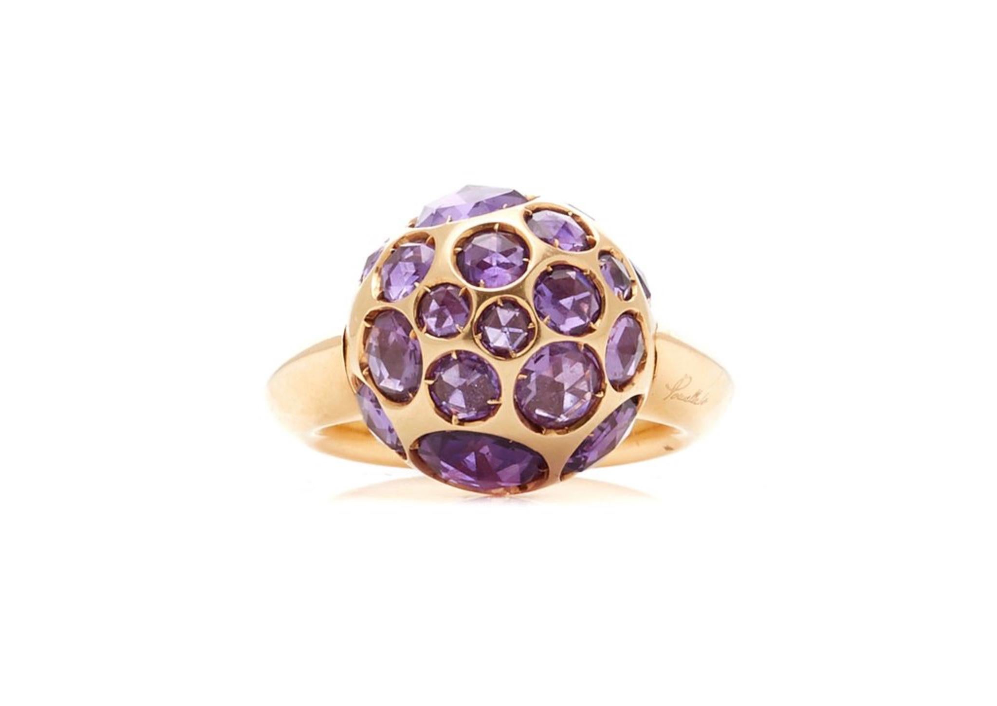 A chic amethyst harem ring by Pomellato featuring rose cut amethysts set in 18 karat yellow gold. Currently size 7.25 and can be resized.