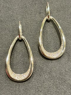 Pomellato asymetrical dangly white gold and diamond earrings