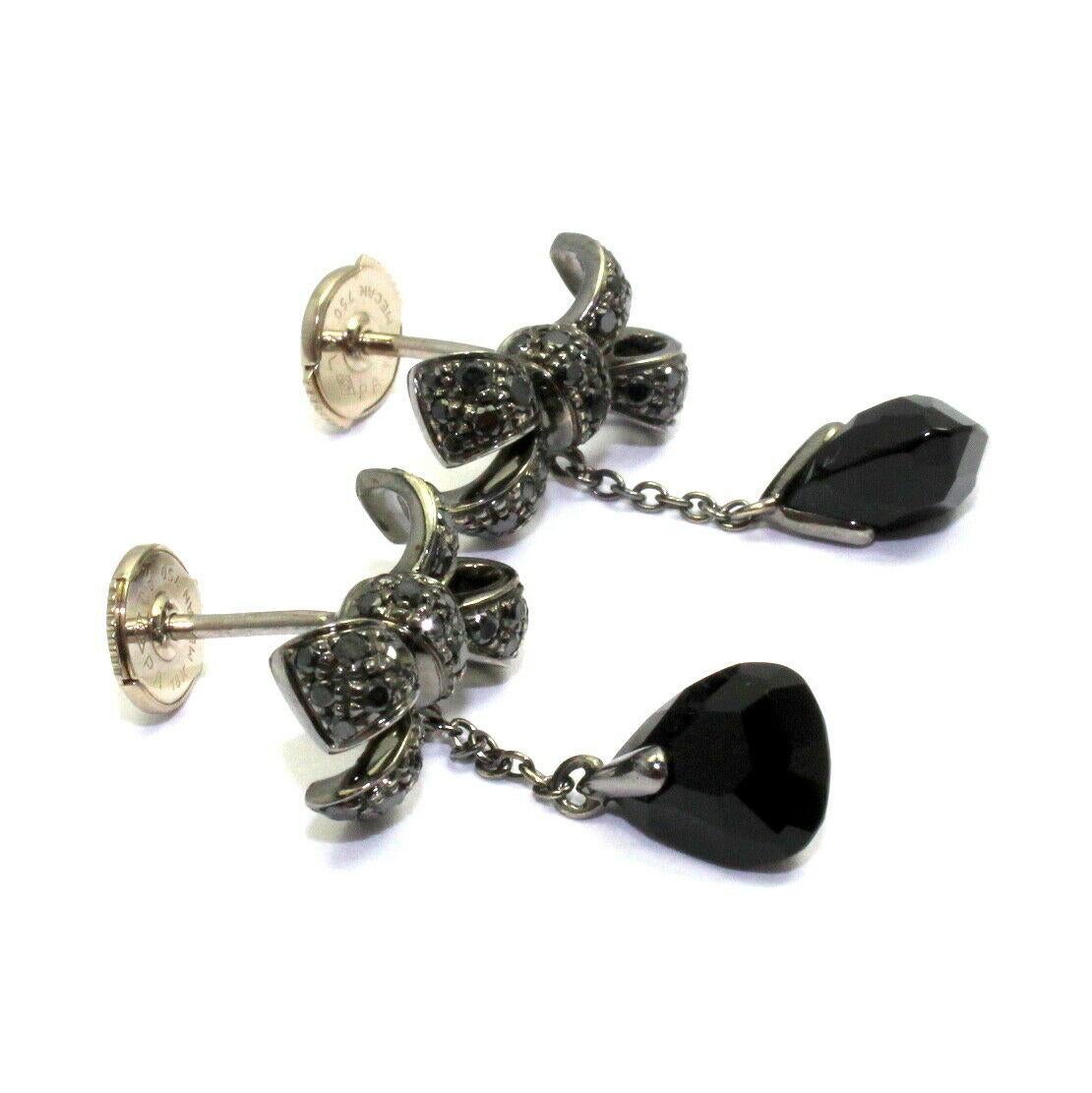 18k Blackened White Gold Black Diamond Onyx Drop Bow Earrings by Pomellato. 
With Black diamonds - 0.64ctw
2x medium onyx briolette cut
These earrings come with original Pomellato box and a certificate. 
Details: 
Measurements: 15.5mm x