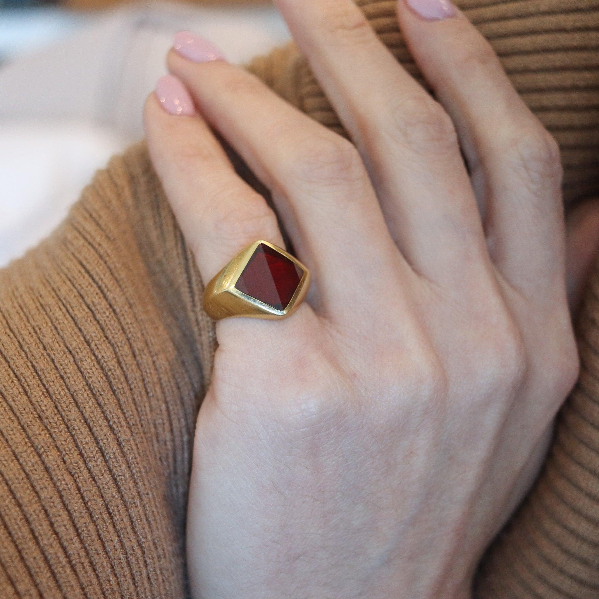 Geometric cocktail ring designed by Pomellato.

This is a very beautiful and sleek cocktail ring created in Milano Italy by the jewelry house of Pomellato. This vintage cocktail ring has been crafted in solid yellow gold of 18 karats with polished