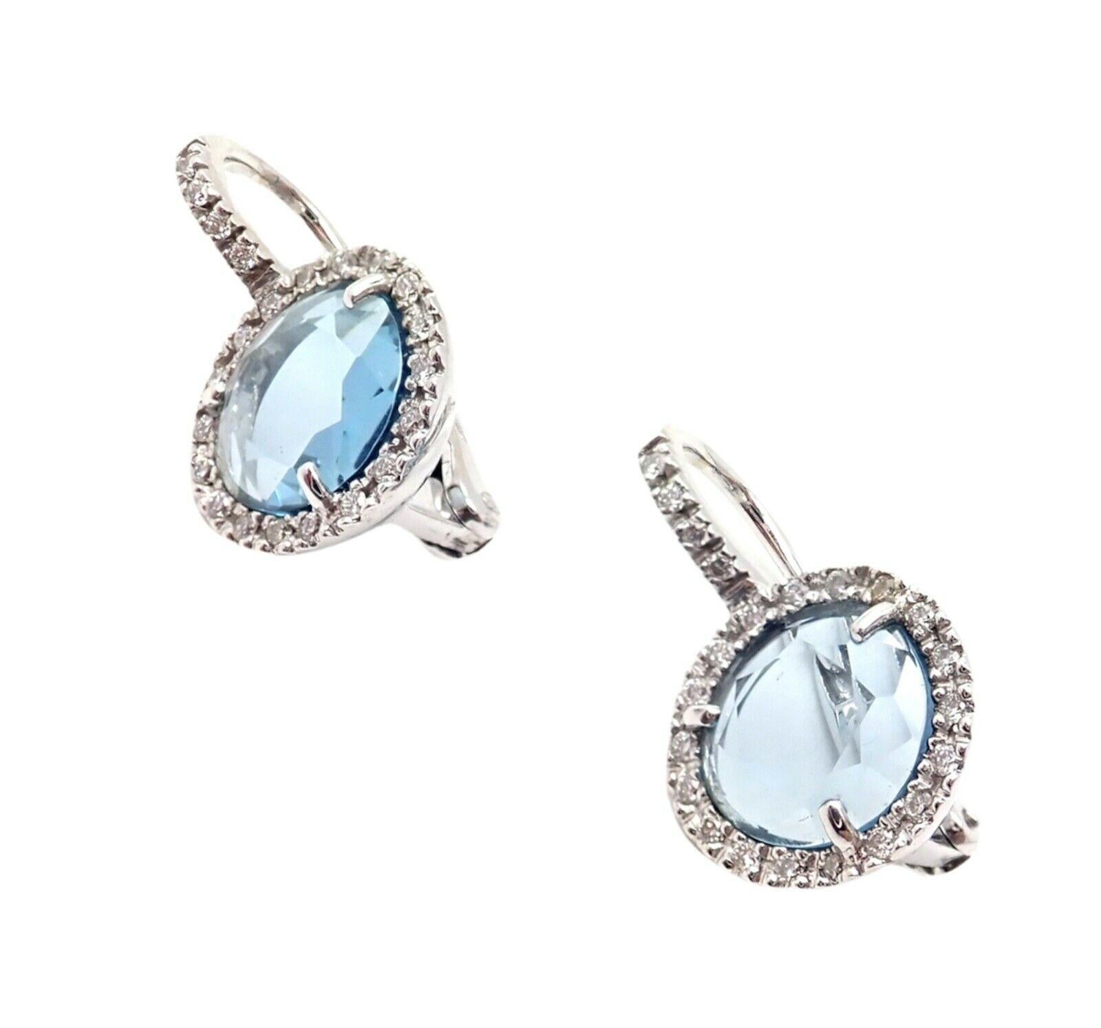 18k Weißgold Diamant Blautopas Colpo Di Fulmine Ohrringe von Pomellato.
Mit 2 ovalen Blautopas-Steinen - 9mm x 8mm
46 runde Brillanten - 0,45ctw
Diese Ohrringe sind für gepiercte Ohren.
Einzelheiten:
Abmessungen: Gesamt - 20mm Länge
Größe des