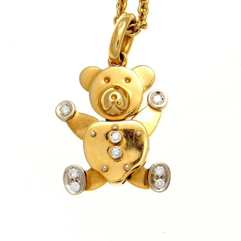 The huggable teddy bear no one ever wants to leave behind is recreated by the modern Italian jewelry designer Pomellato. Designed with 8 colorless diamonds dressing up this adorable free moving bear. Crafted in glistening fine 18k gold. Signed