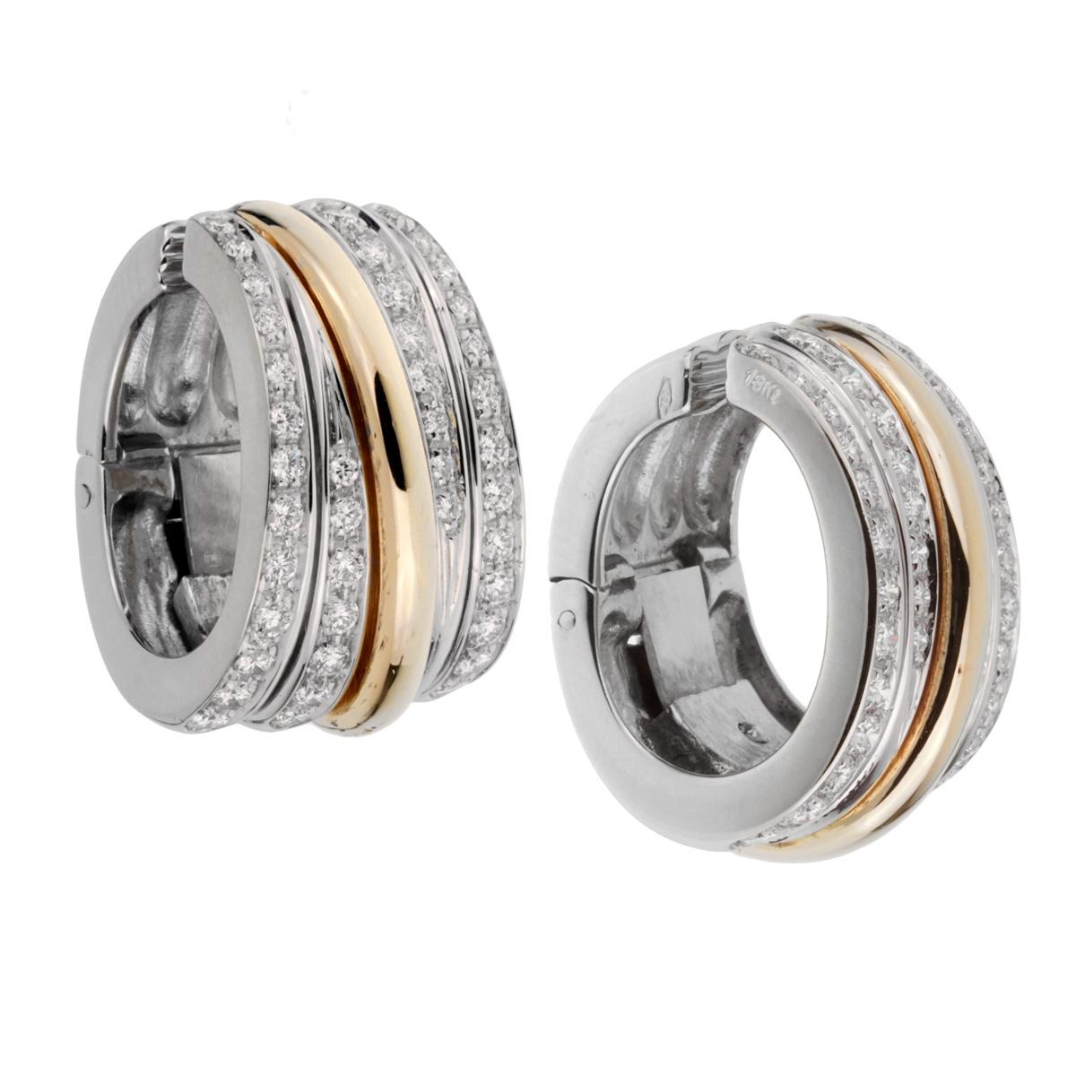 A chic set of Pomellato diamond clip on earrings featuring 18k white and yellow gold with magnificent round brilliant cut diamonds.