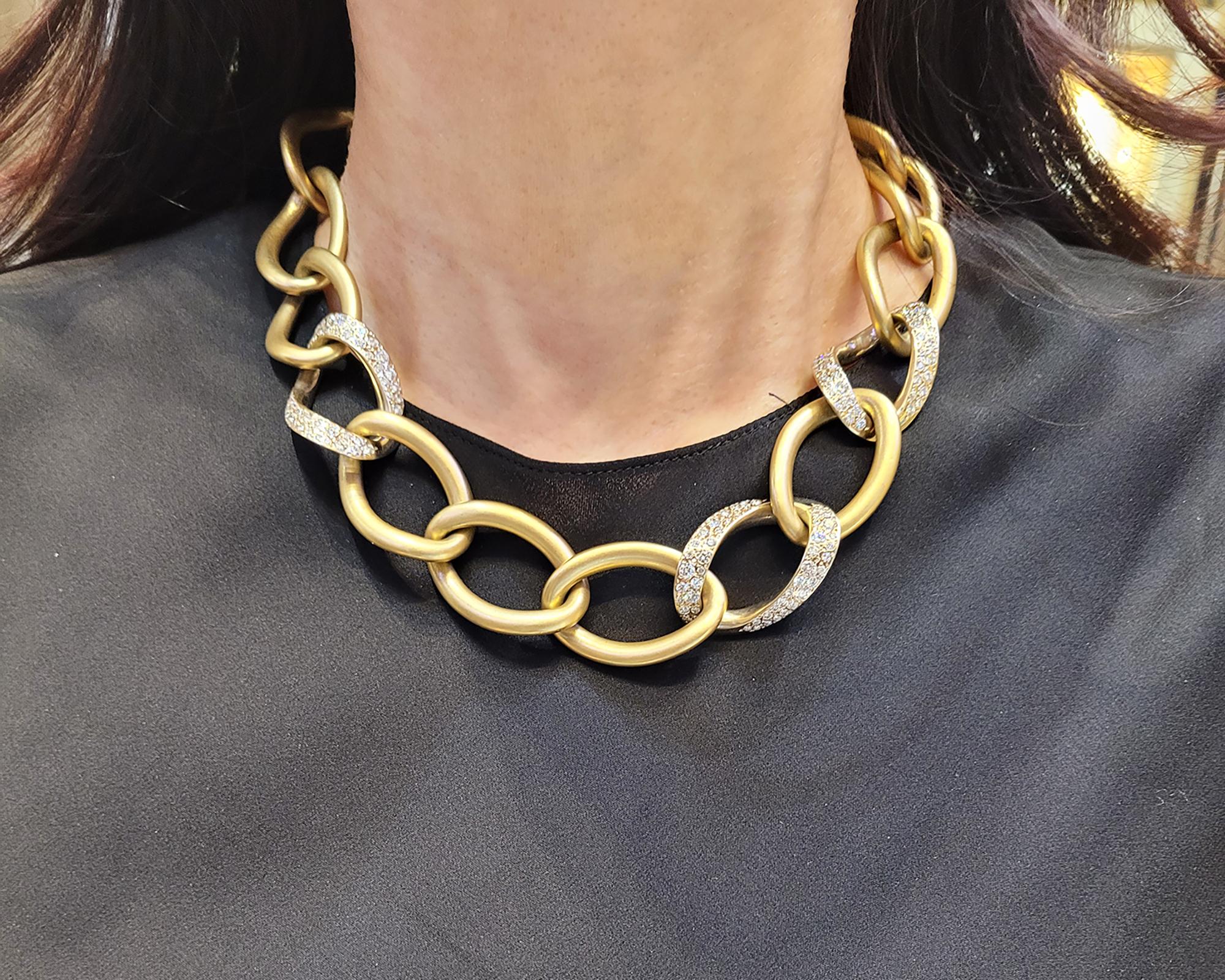 An elegant necklace designed as links and decorated with diamonds.
Created by Pomellato in Italy. 
Made in 18K yellow-green gold with matte finish. Weight of gold is 160 grams.
Three links are embellished with diamonds weighing 4.26 carats. 
The