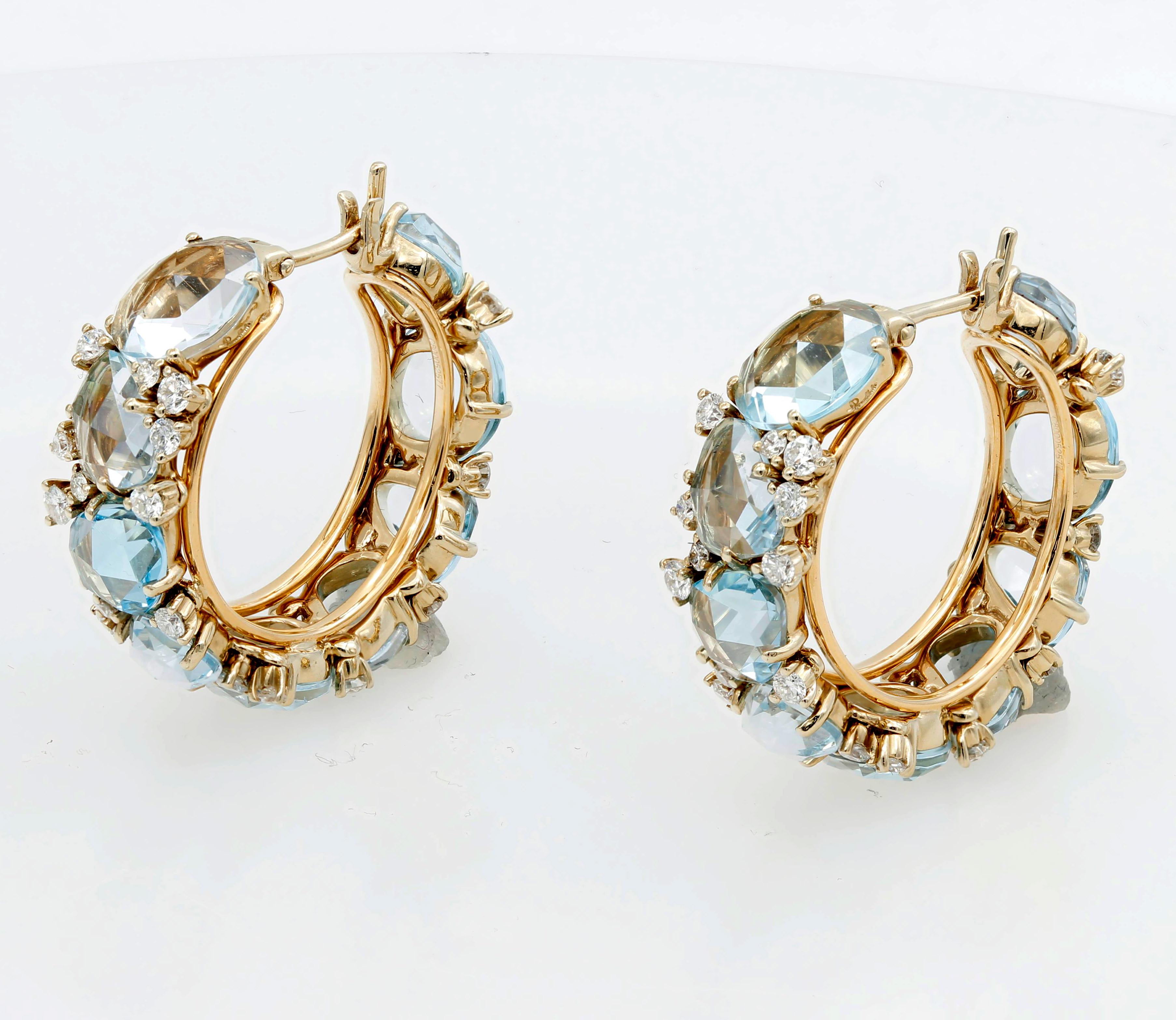 A pair of new impressive hoop earrings, crafted by Pomellato for Lulu collection, decorated with topaz gemstones and diamonds. 

Designer: Pomellato
Material: 18K Gold
Gemstone: G/VS Diamonds - approx. 1.02ctw, Topaz
Dimensions: Hoops are 28mm in