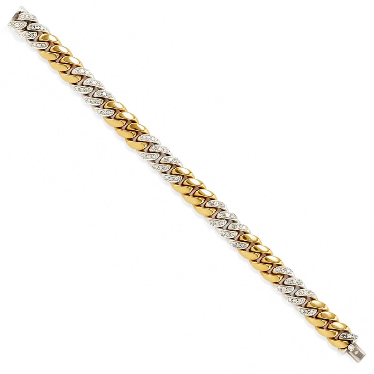 A classic must have for every wardrobe, this chic bracelet by Pomellato features 18k white and yellow alternating curb links encrusted with round brilliant cut diamonds. .90ct appx 