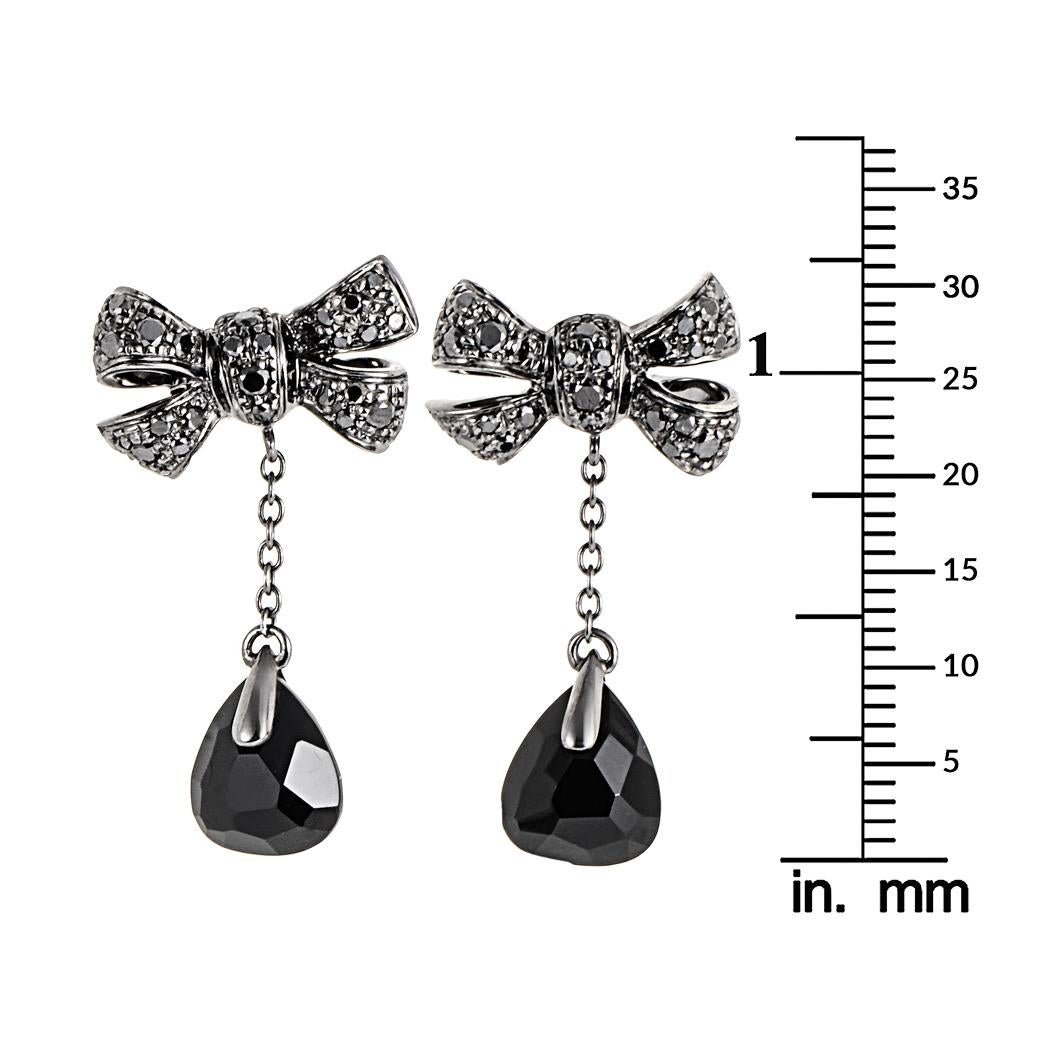 This pair of Pomellato Forever bow earrings are feminine and unique. They are made of 18K blackened white gold. The bow is diamond pave with ~.64CT of black diamonds and features large onyx gemstones.
