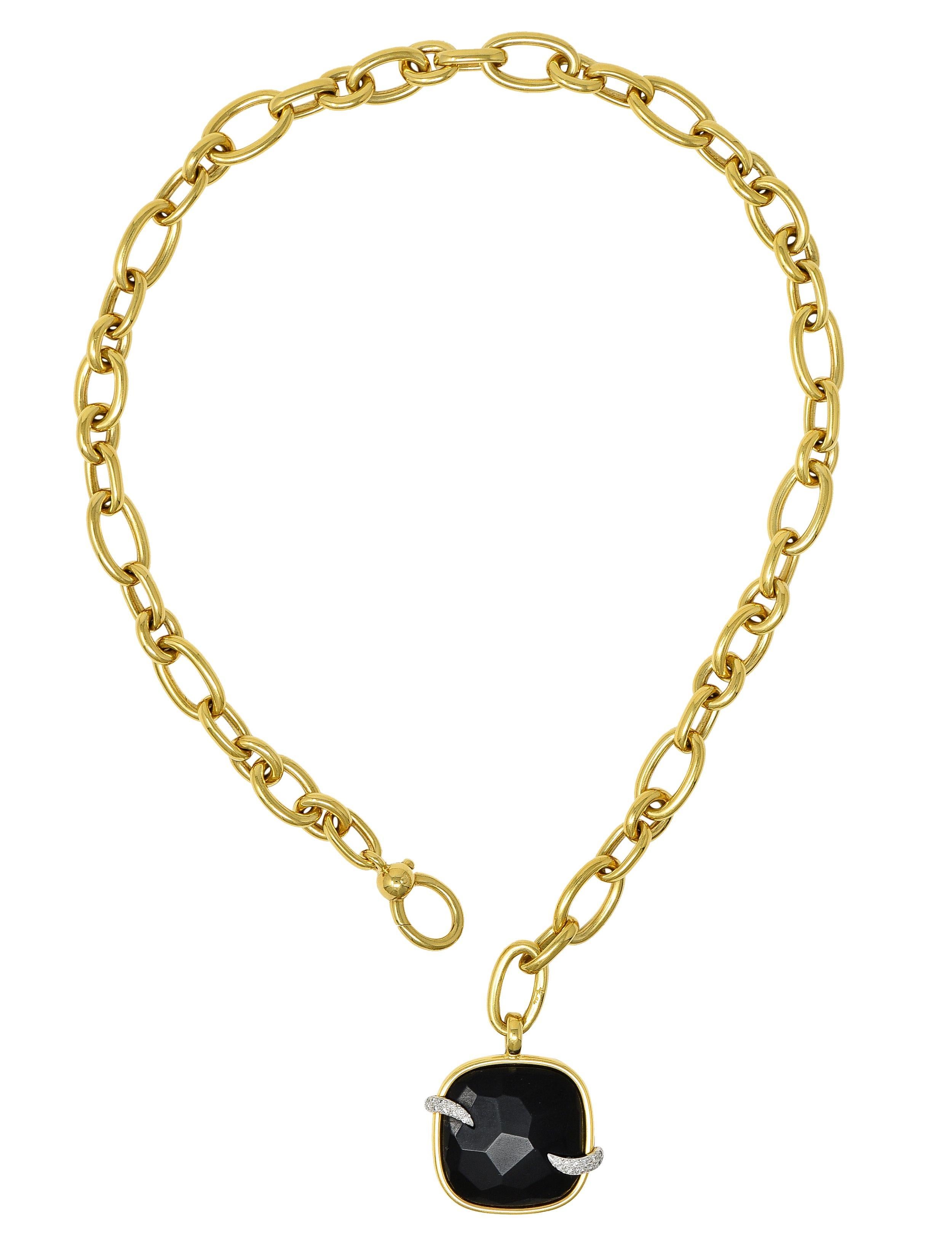 Designed as a large 10.0 mm cable link chain suspending a cushion-shaped pendant
Centering a faceted tablet of jet - opaque glossy black with gold bezel surround
Accented by white gold swirls pavé set with round brilliant cut diamonds 
Weighing