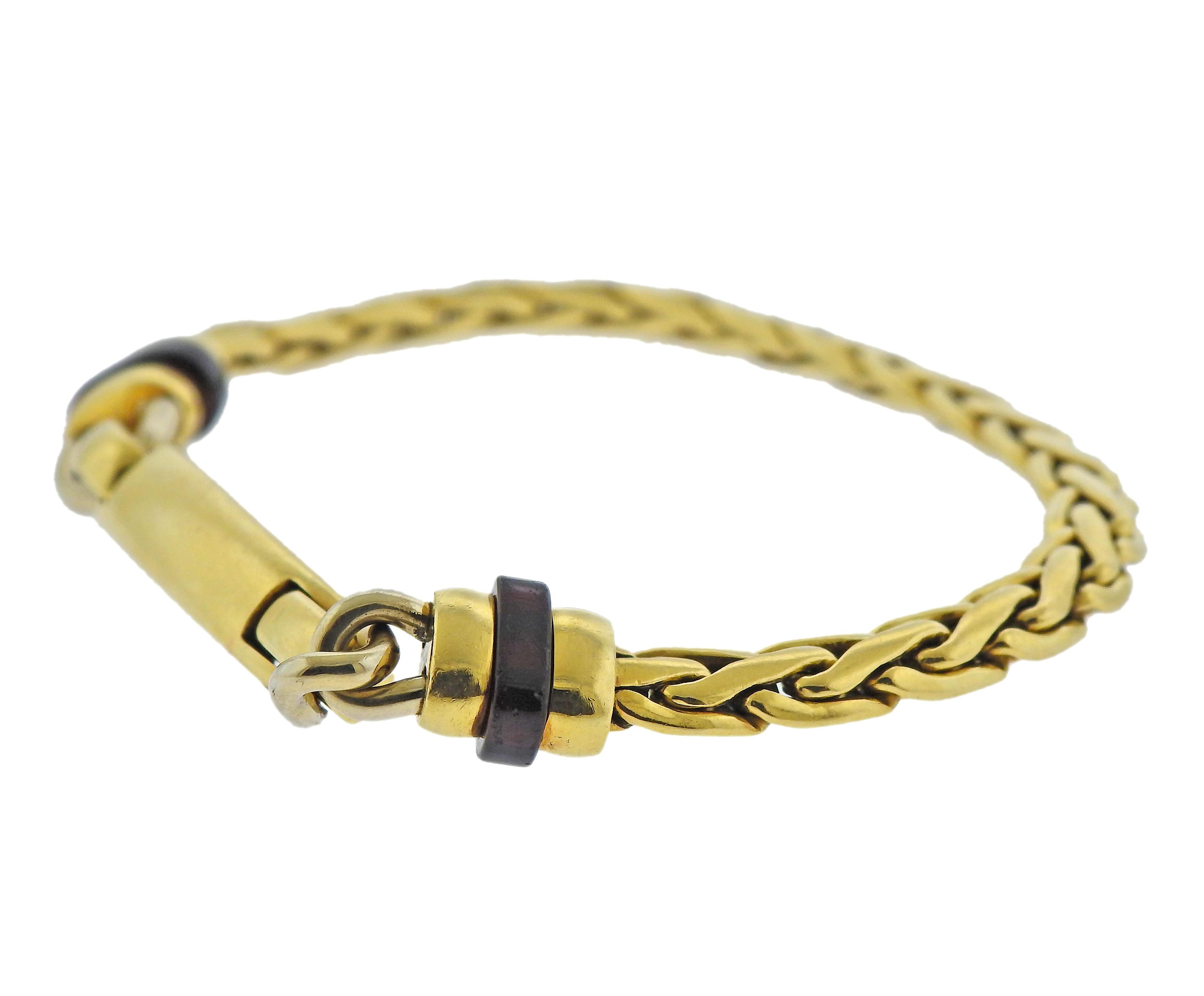 Vintage 18k gold Pomellato bracelet with garnets. Bracelet is 7