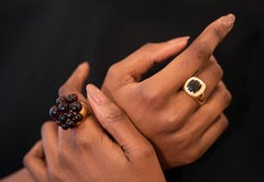 Mora-Ring aus Gelbgold mit Granat, um 1980